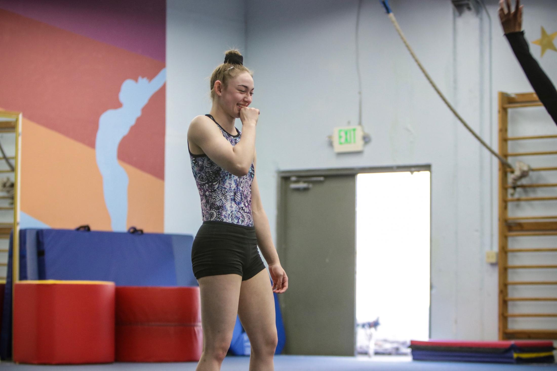 Hope Takahashi laughs at her friend at Paramount Gymnastics, in San Jose, Calif., on Tuesday, Apr. 30, 2019.