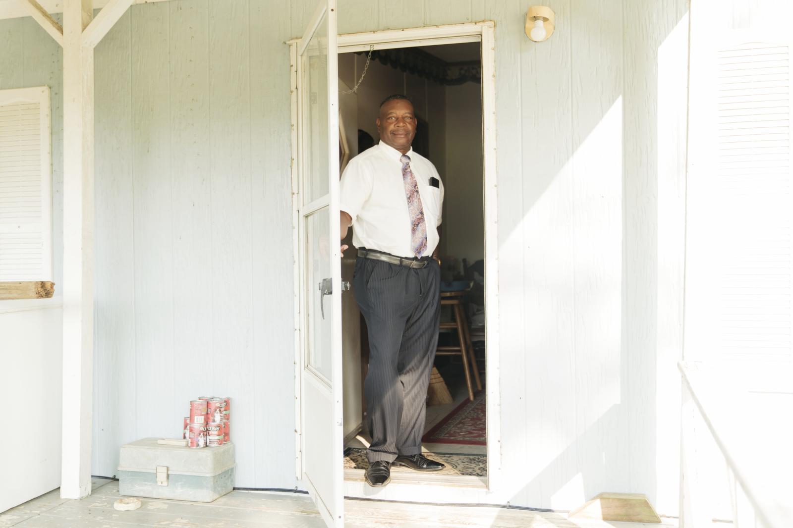 FOREST, USA -- MAY 26: Carlton Sanders ons his front porch before leaving for church on May 26,...