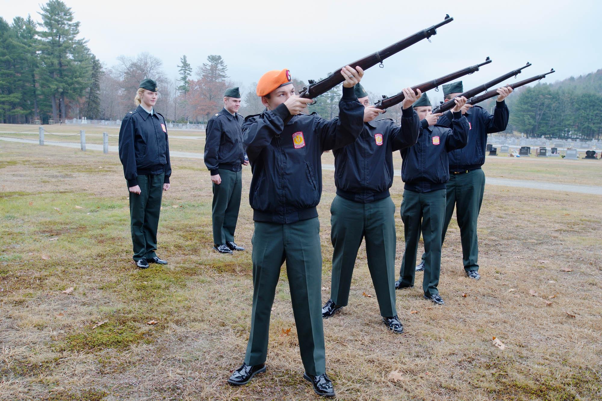 Cadets - The JROTC Funeral Detail firing a last salute at the...