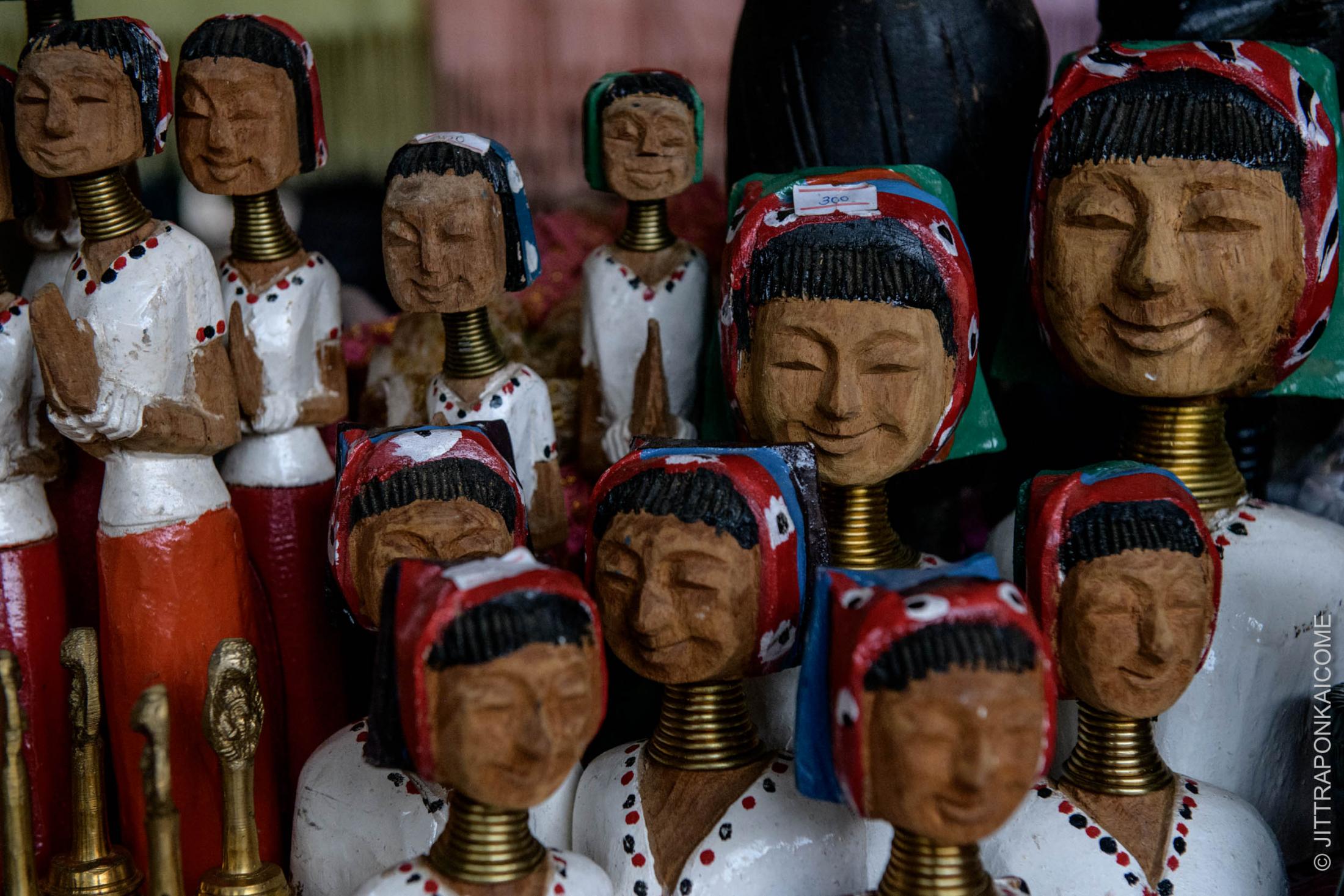 Kayan Long Neck Refugee - Wood carving souvenirs of a long neck woman are left in a...