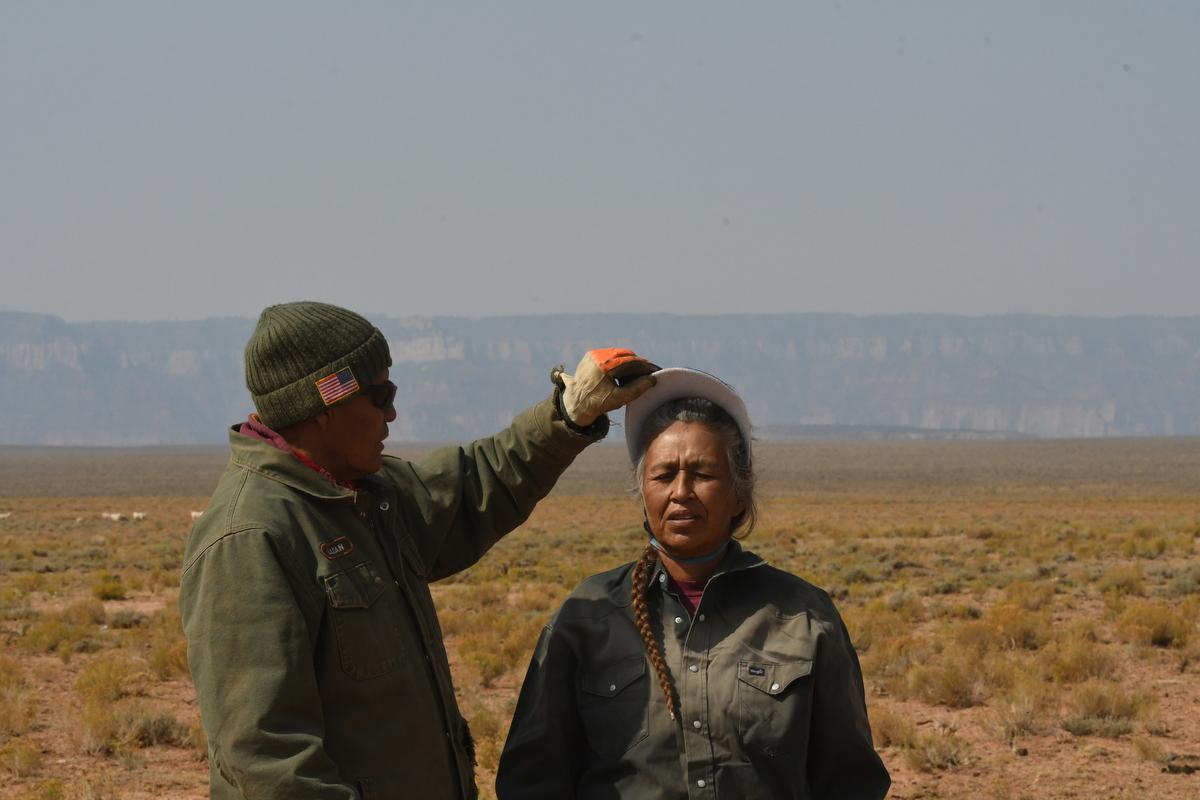 Leonard Sloan lifts the visor o... the edge of the Grand Canyon. 