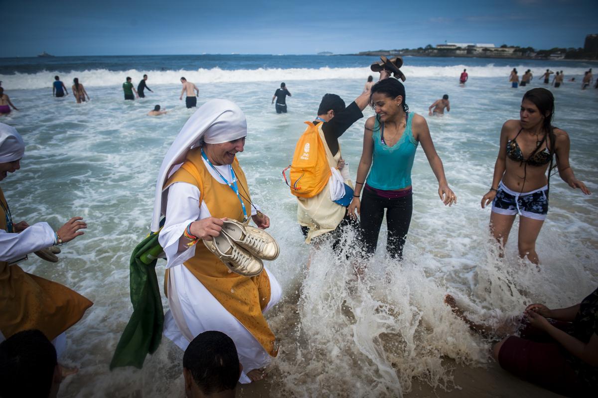 Nuns wade in the Copacabana beach water, in Rio de Janeiro, Brazil, Sunday, July 28, 2013. Pope Francis wrapped up a historic trip to his home...