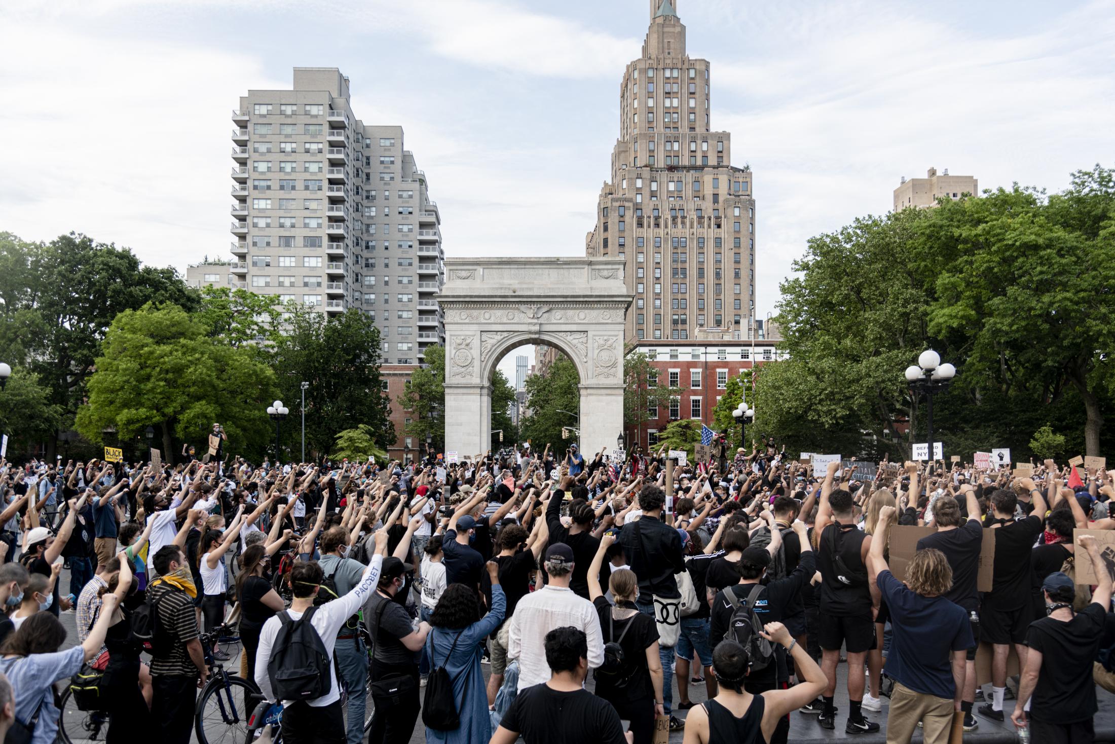 Hundreds of protesters chanting at the Washington Square Park arch in Manhattan. New York,...