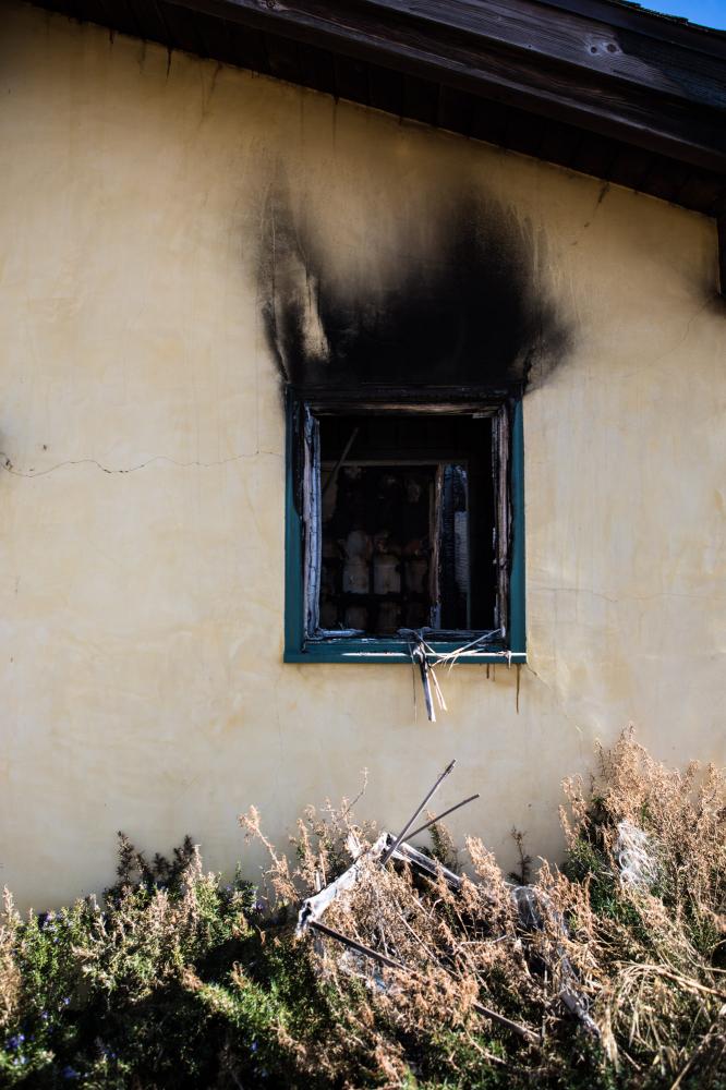 A window from a home that partl...in the Woolsey fire, Malibu CA.