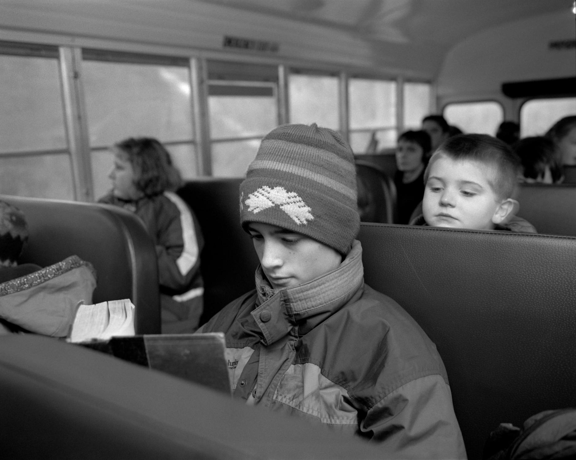 American Moments - Reading Capital by Karl Marx on school bus 14. Marlboro,...