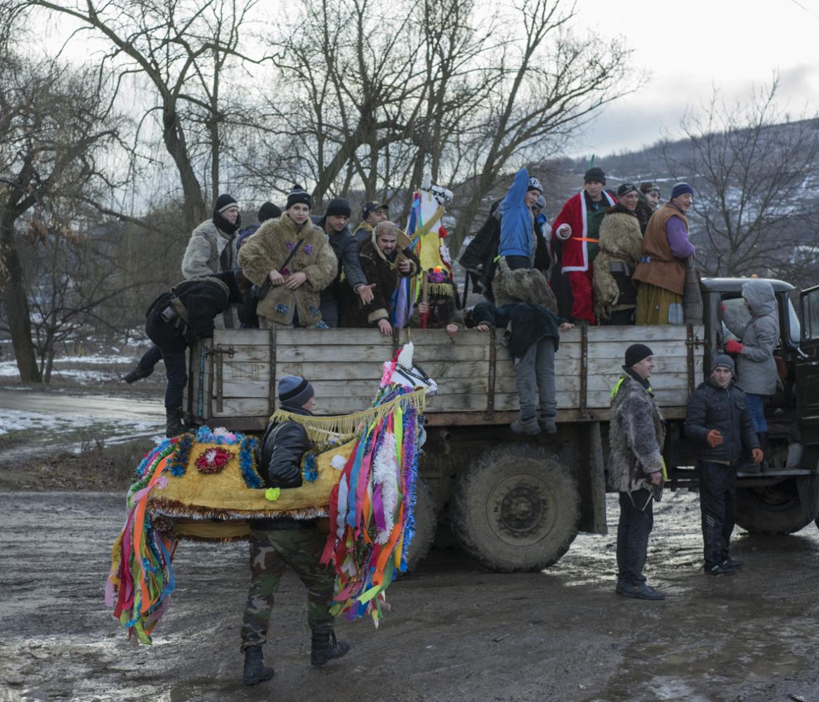 Image from Malanca in Palanca -  All the group of masks jump on an old Soviet truck as...