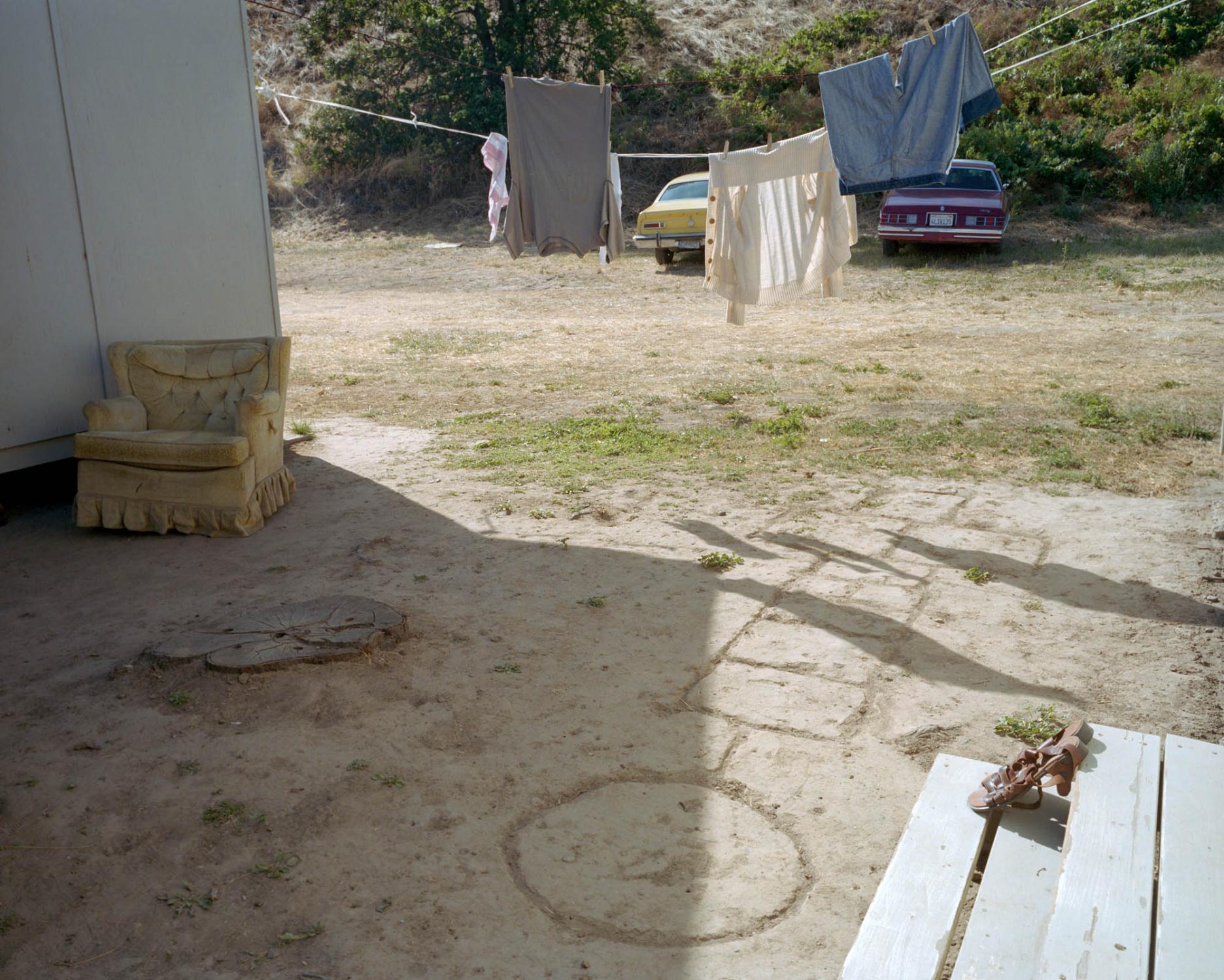 Mexican children have drawn a hopscotch game in the sand of a migrant farmworker camp at one of the fruit companies in the Hood River Valley. Fruit...