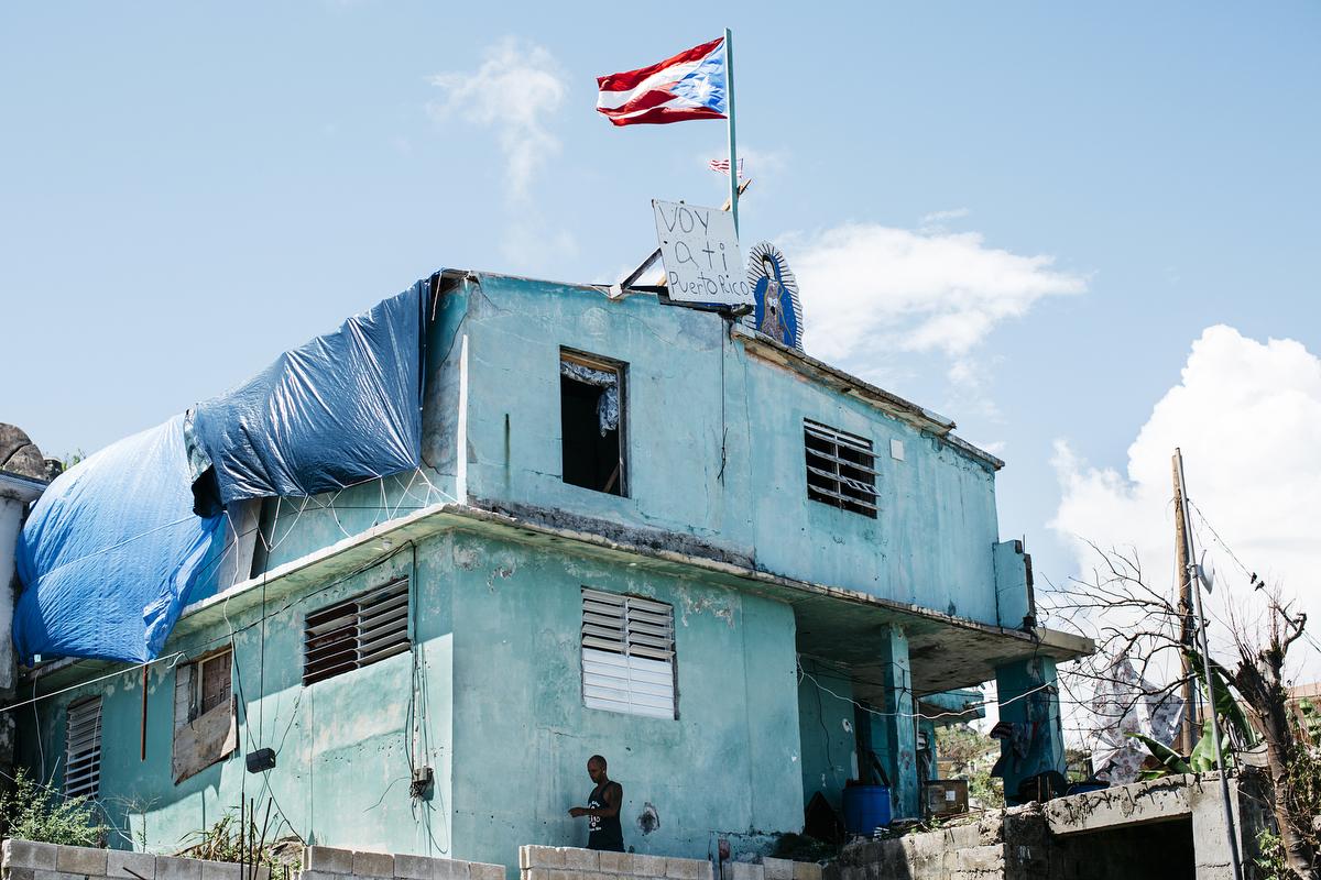 A home in the southeastern coast of Maunabo, where hurricane Mar&iacute;a entered the island. On the roof, along side the Puerto Rican and American Flag, a signs says, &quot;Yo voy a ti P.R.&quot;, which roughly translates to &quot;I am rooting for you Puerto Rico.&quot;