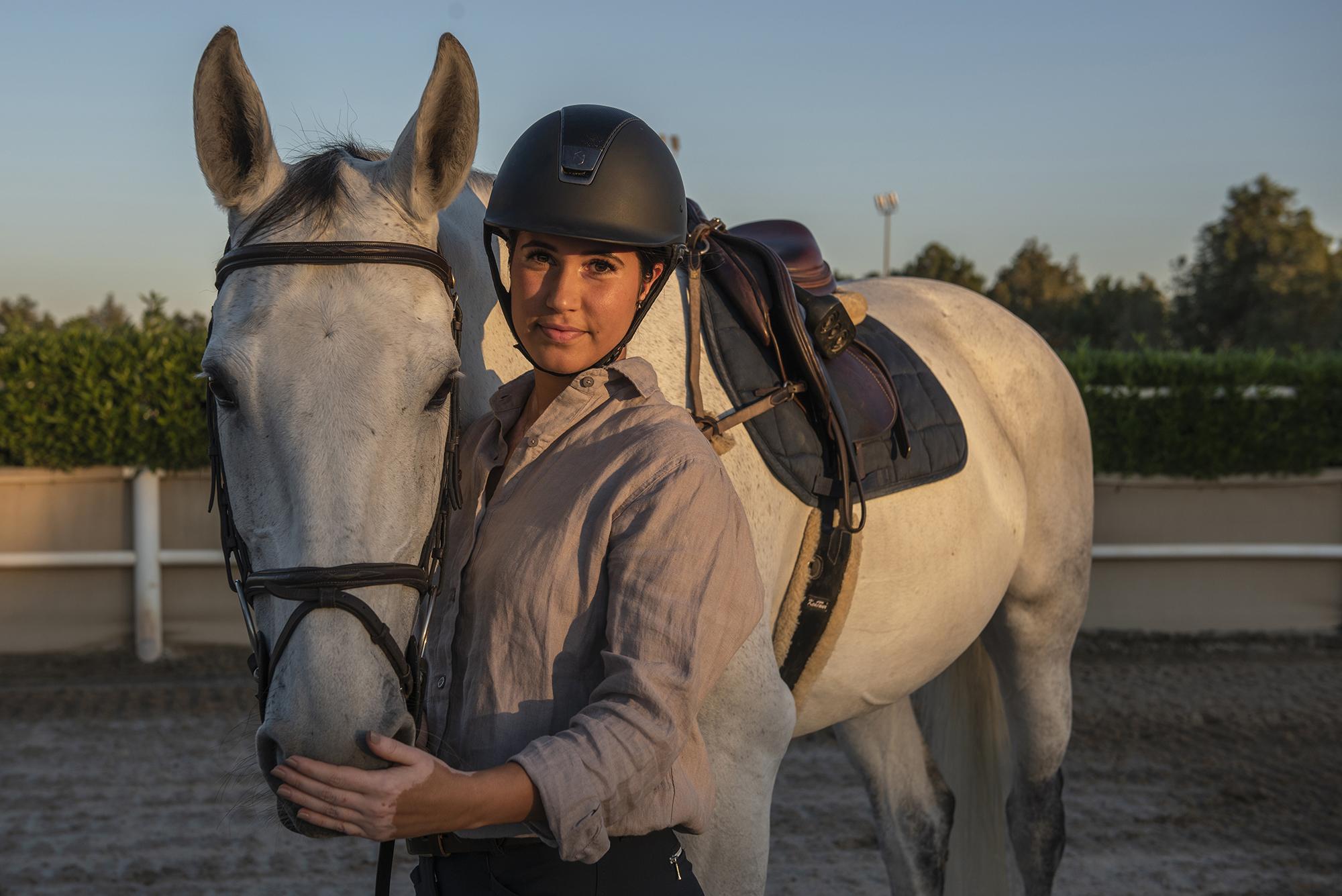 Emirati Woman: Living Dappled - "I feel it's unique" -  Nadine with her horse Molly, she say's "bonding...