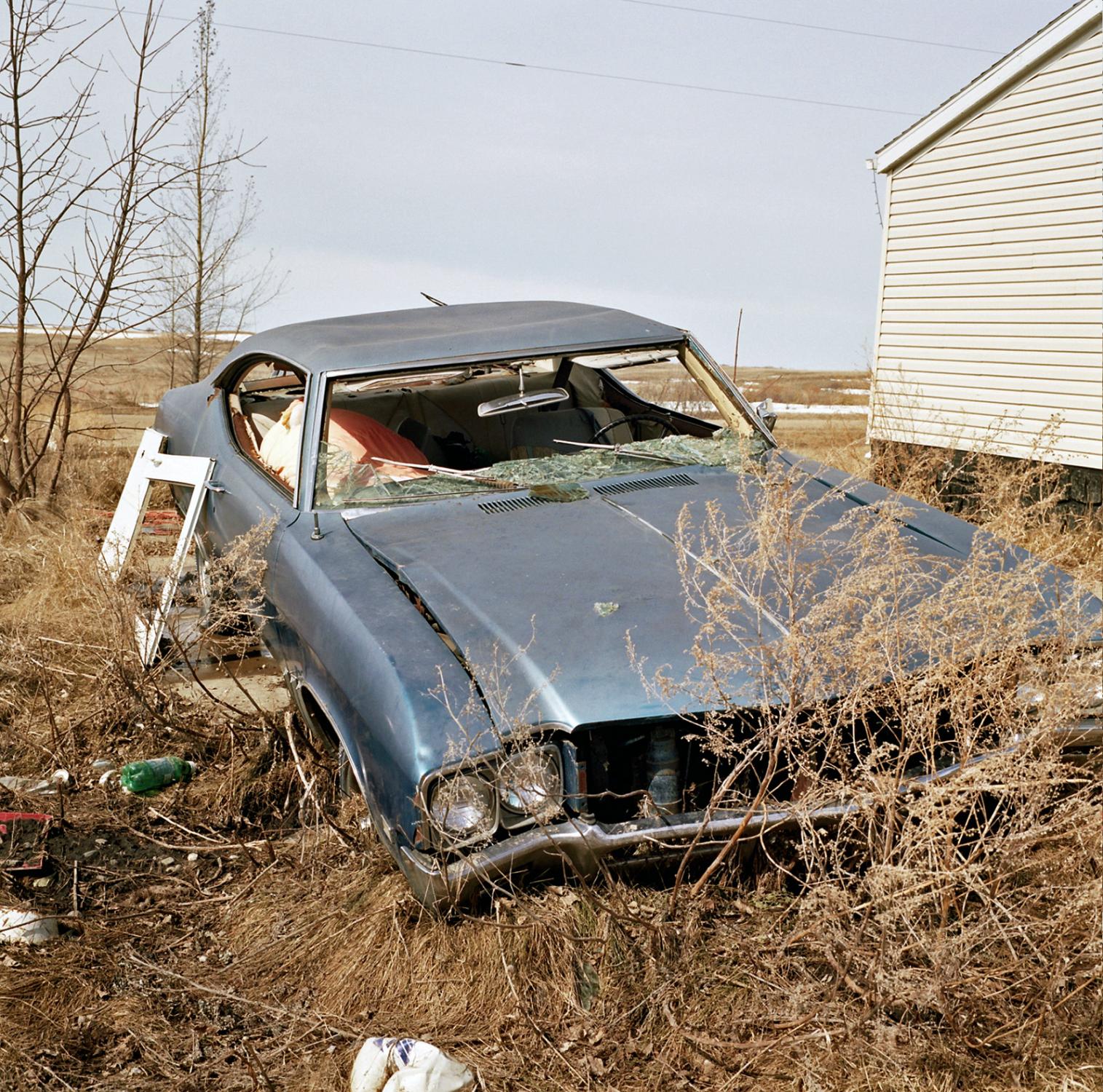 Spirit Lake - Broken discarded car near a home in St. Michaels, Spirit...