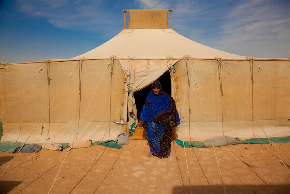 Sahlka stands outside her refug...ving in this tent for 35 years.