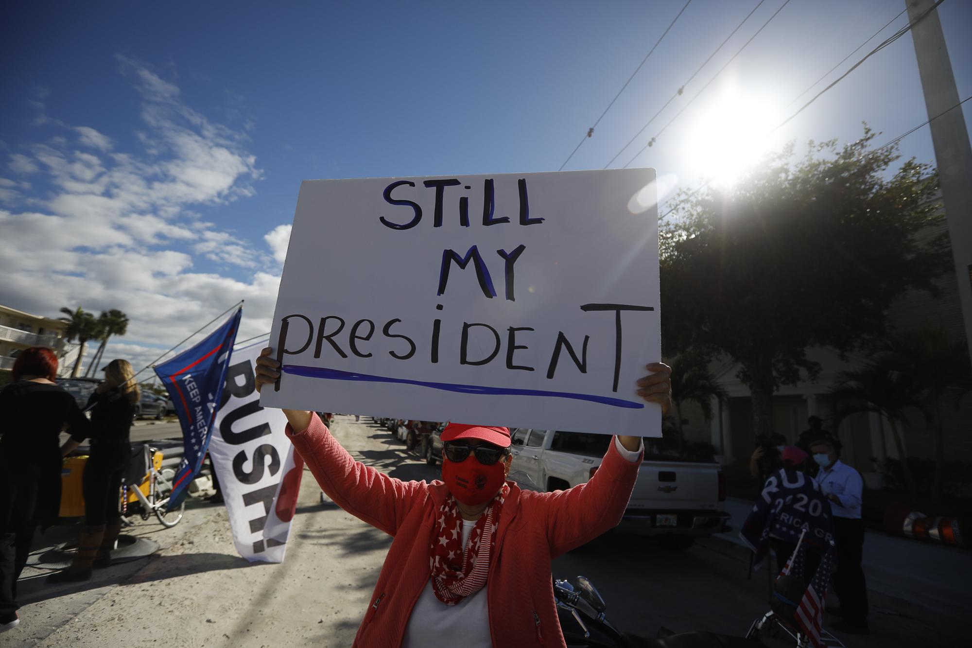 Farewell Mr. Trump - Supporters of President Donald Trump stand near the road...