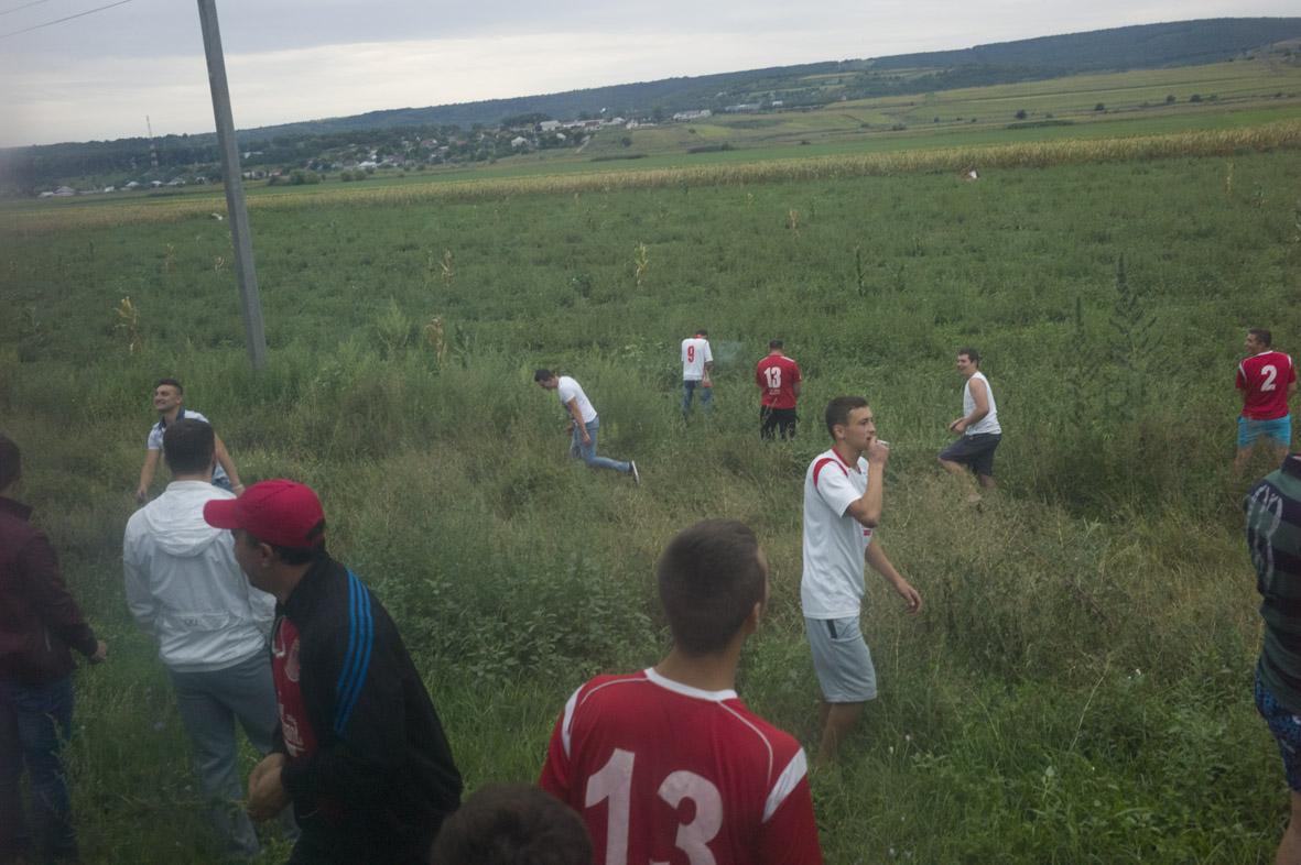 Republic of Moldova / Orhei / Viewed though the bus window, the supporters of FC Milsami Orhei...