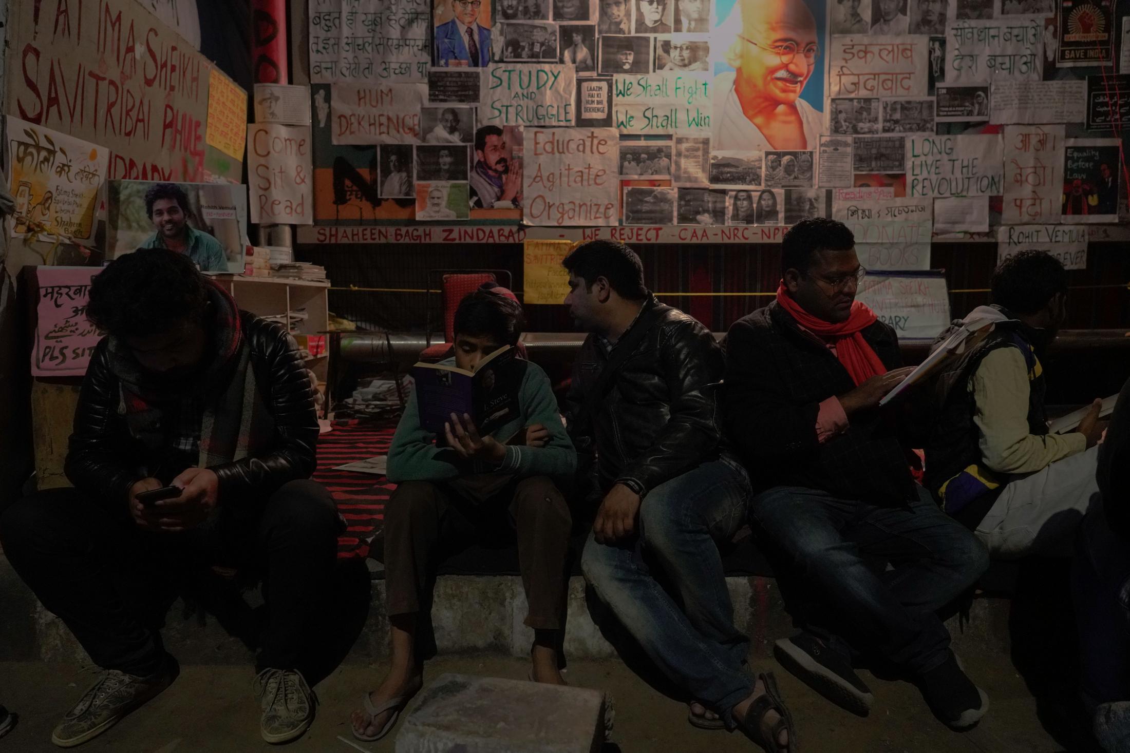 Aazadi - Anti-CAA protesters read books at a makeshift library...