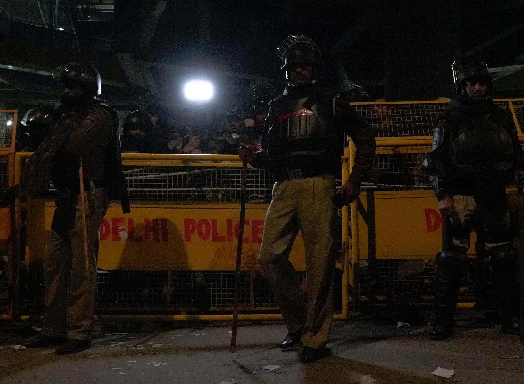Aazadi - Delhi Police stand guard outside Jamia Millia Islamia...