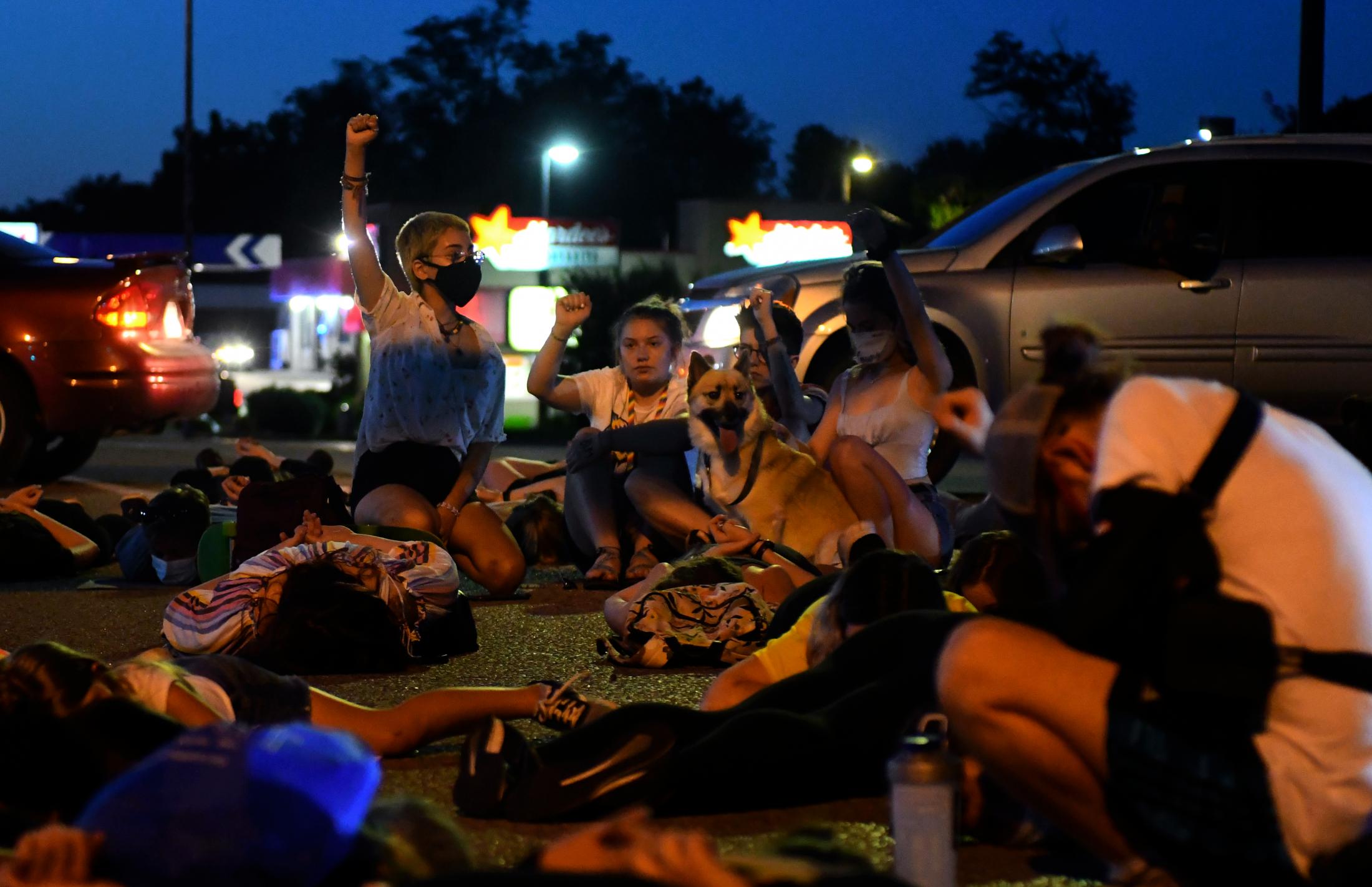 A Summer of Social Justice - Protesters stop to kneel and lay down for eight minutes...