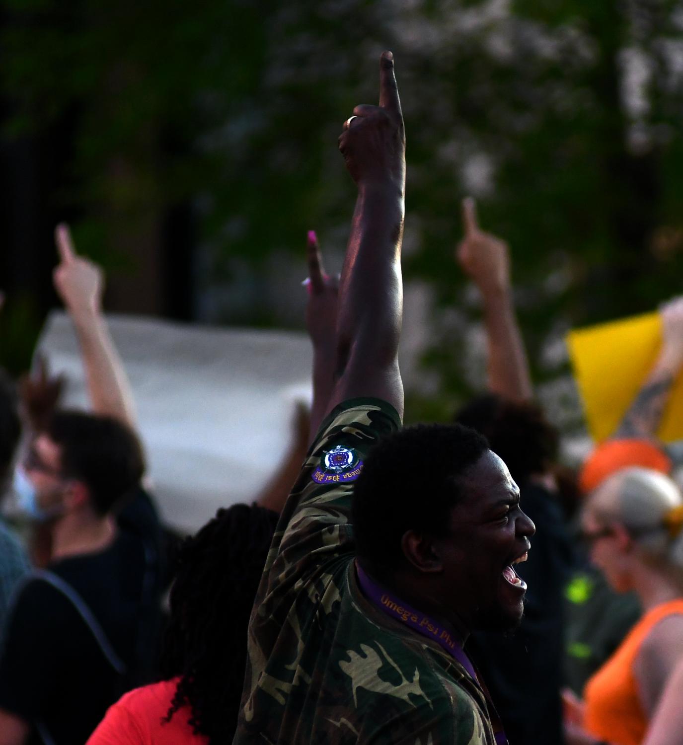 A Summer of Social Justice - Sterling Brown tells other rally attendees to point at a...