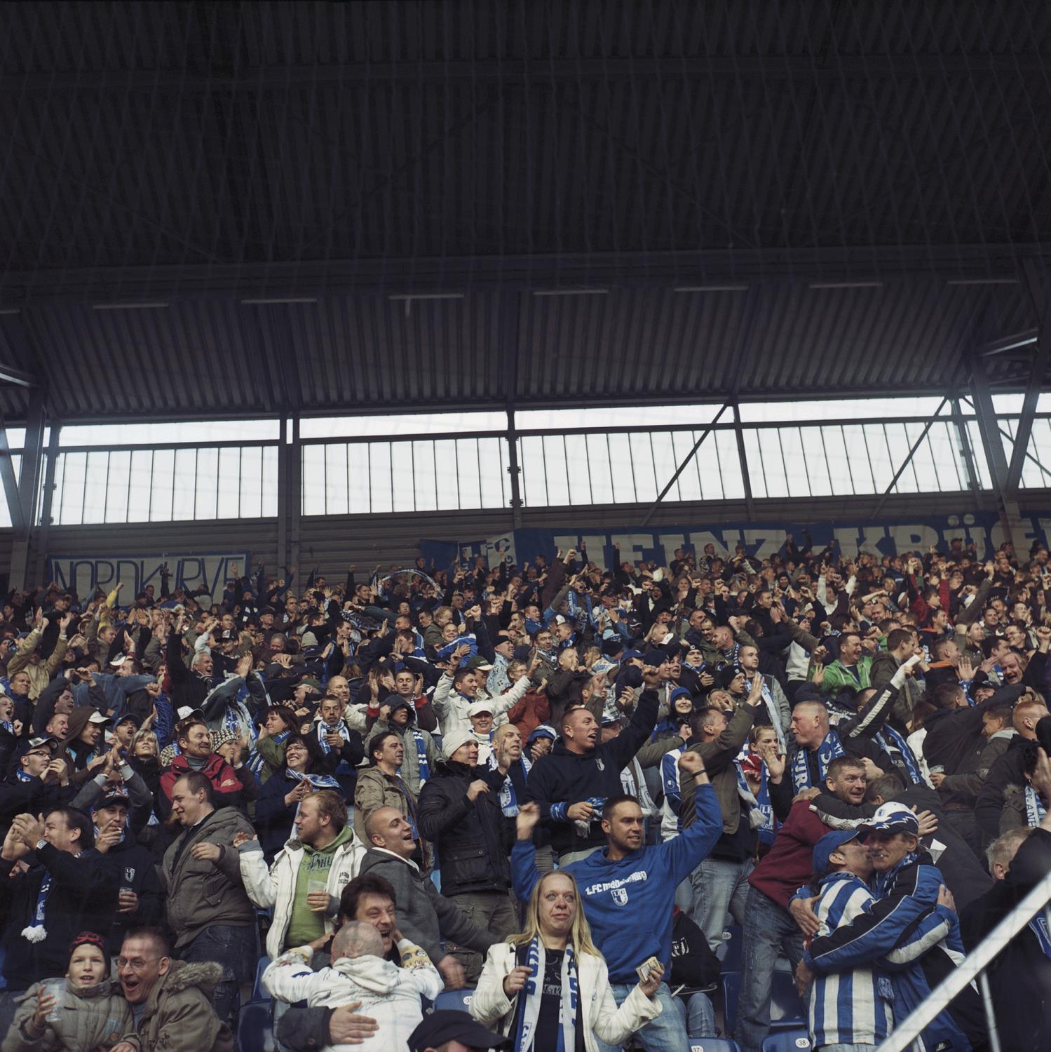 The fans on the terraces in an explosion of joy after a score had been signed by their team,...