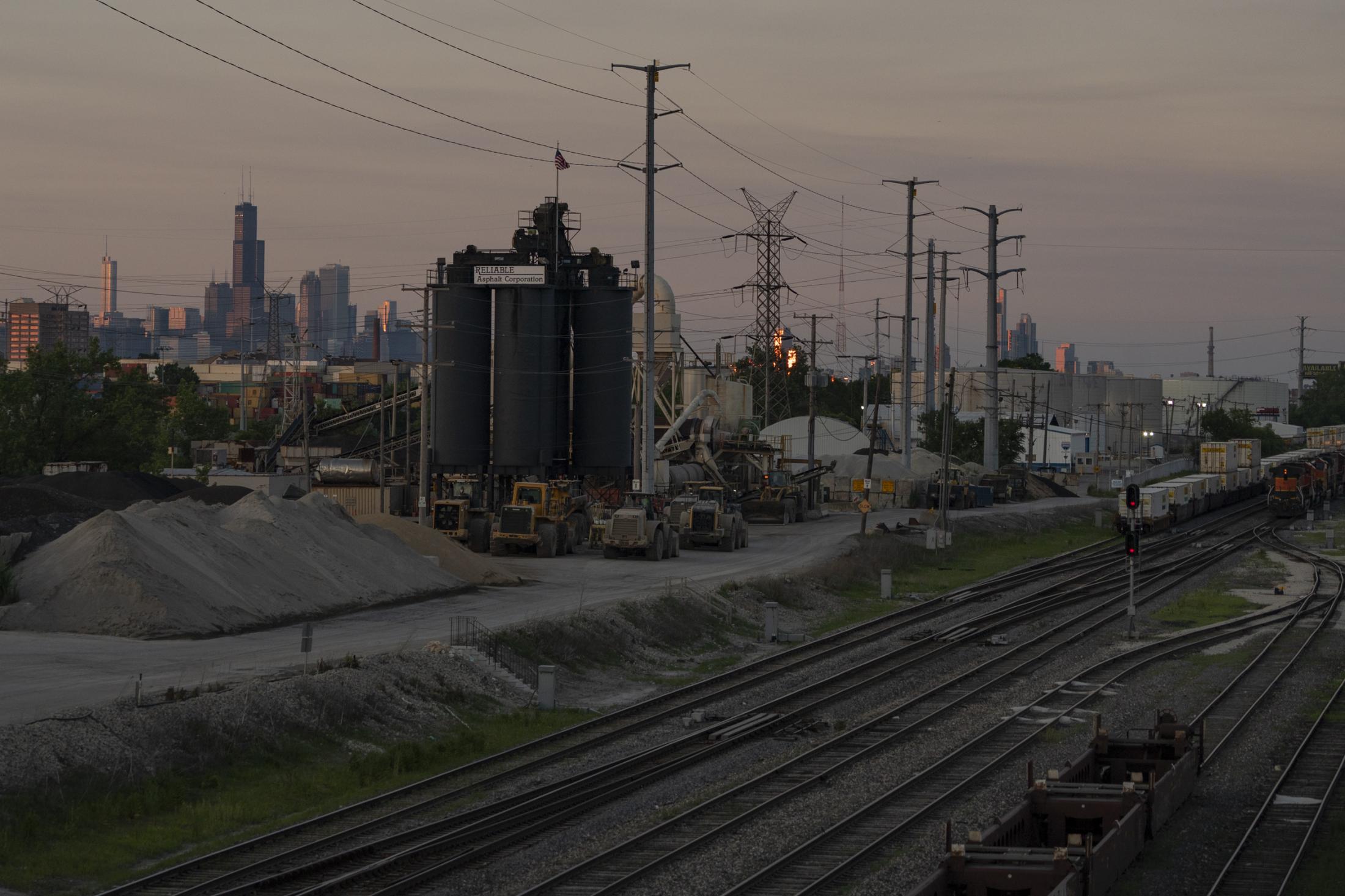 Little Village - The skyline of downtown Chicago parallels the industrial...