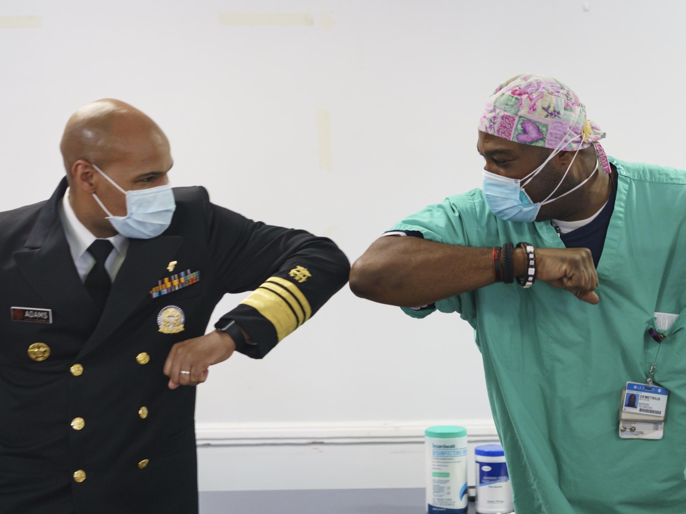 The New Reality - Surgeon General Jerome Adams elbow-bumps ER technician...