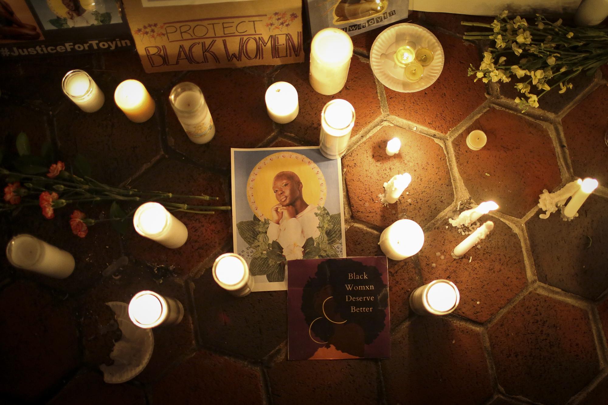 Vigil for Oluwatoyin Salau - Candles enlight a photo of Oluwatoyin Salau during a...