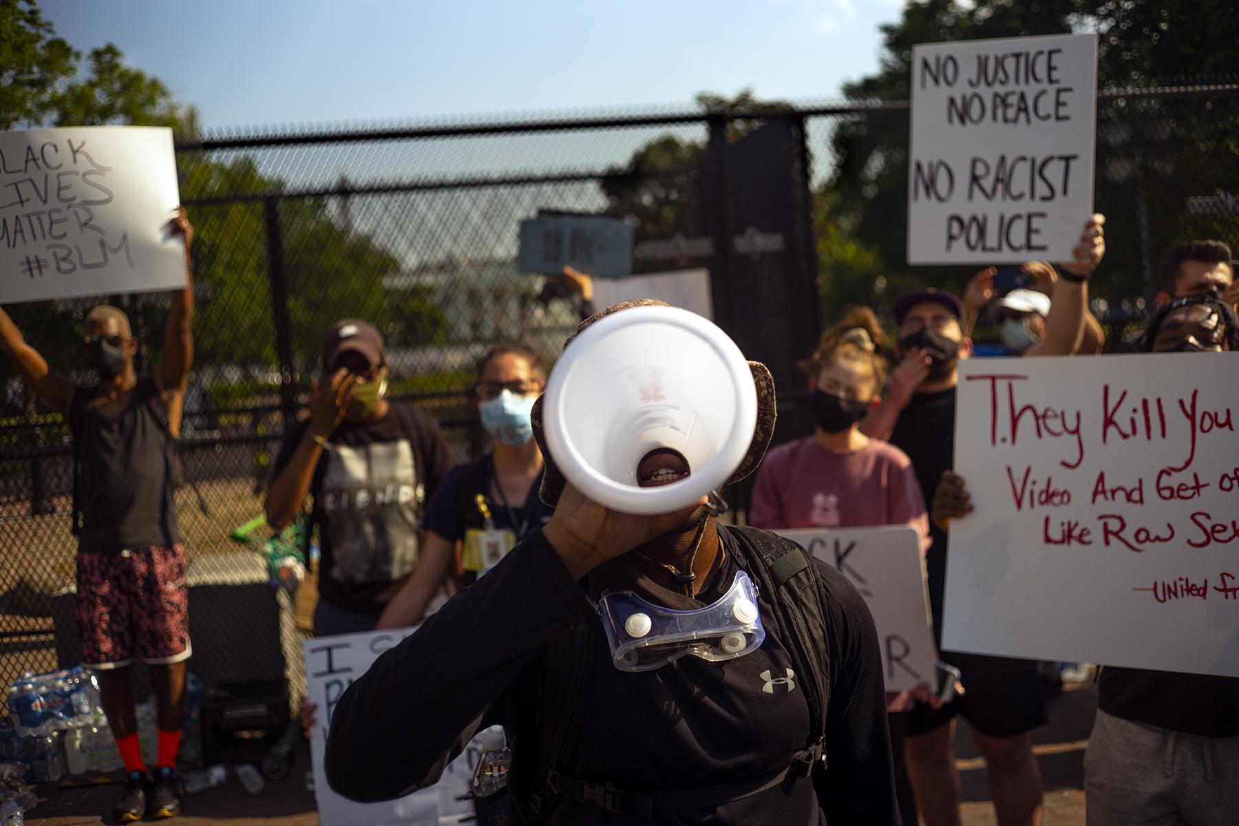 Protests, Pestilence & Politics - Protestors at the fence in Lafayette Square Park in...