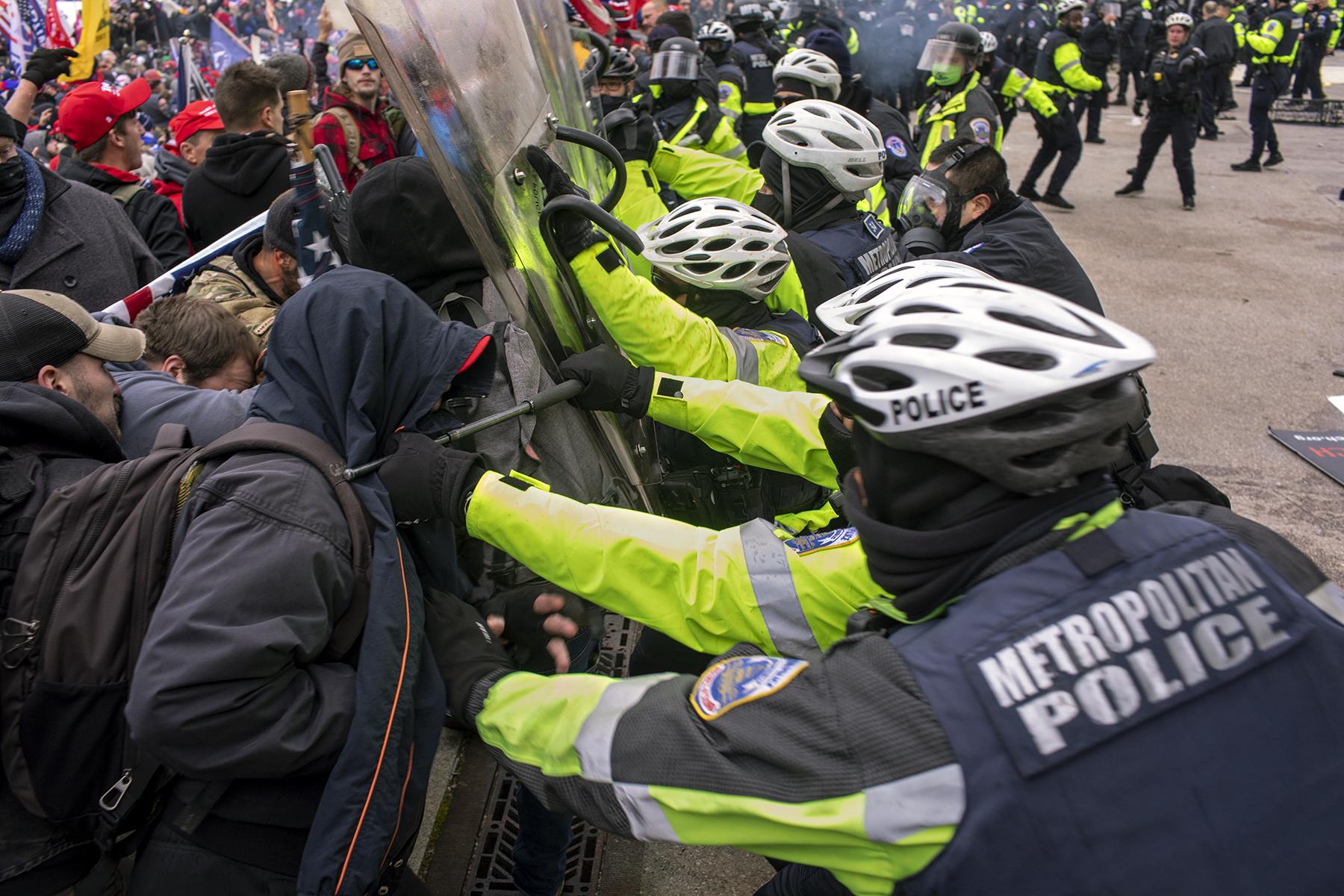 Protests, Pestilence & Politics - Police try to hold the line on the southwest side of the...