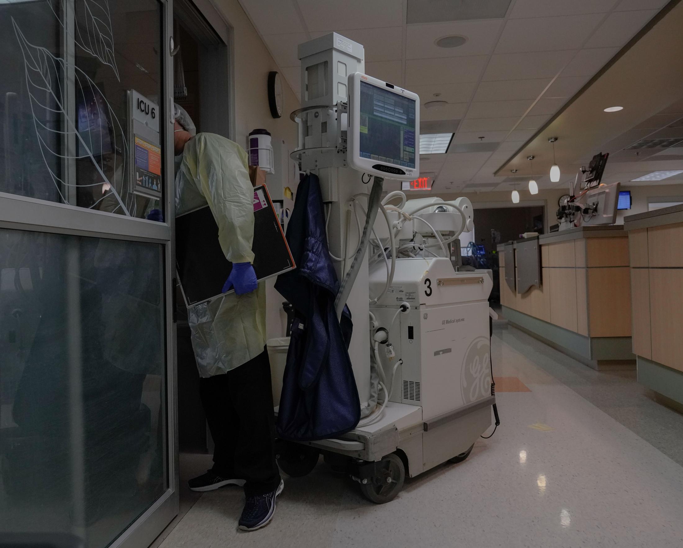 The Missouri ICU - A radiologist peers into an occupied ICU room on Monday,...