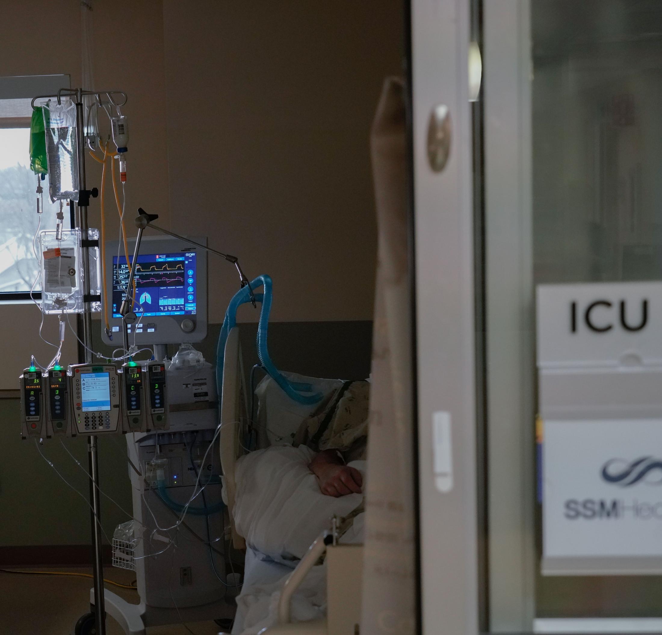 The Missouri ICU - A patient suffering from COVID-19 lies in an ICU bed on...
