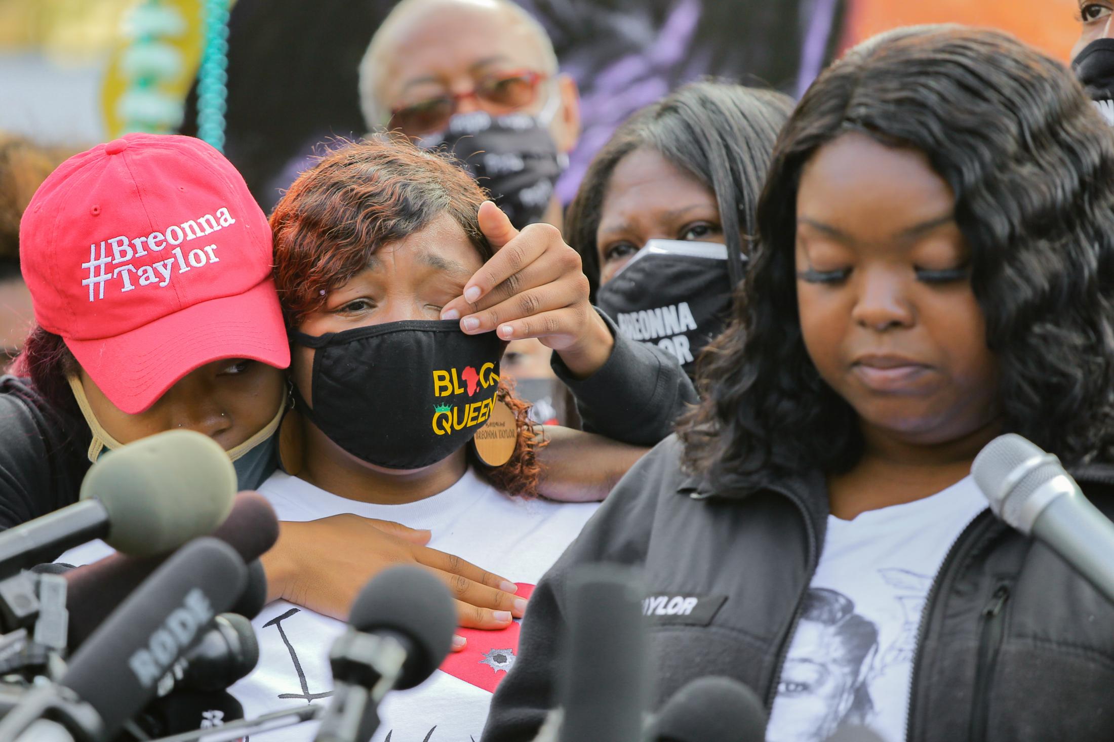 Breonna Taylor&#39;s sister Ju&#39;Niyah Palmer, left, wipes tears from her mother Tamika Palmer&#39;s eyes during a press conference while Taylor&#39;s aunt, Bianca Taylor read a message from the family while wearing Breonna Taylor&#39;s EMS jacket on Sept. 25, 2020, in Jefferson Square Park. &quot;I was reassured on Wednesday of why I have no faith in the legal system, the police and the law that are not made to protect us black and brown people, but when I speak on it I am considered an angry black woman&quot;, Bianca Taylor said about the grand jury decision earlier in the week.