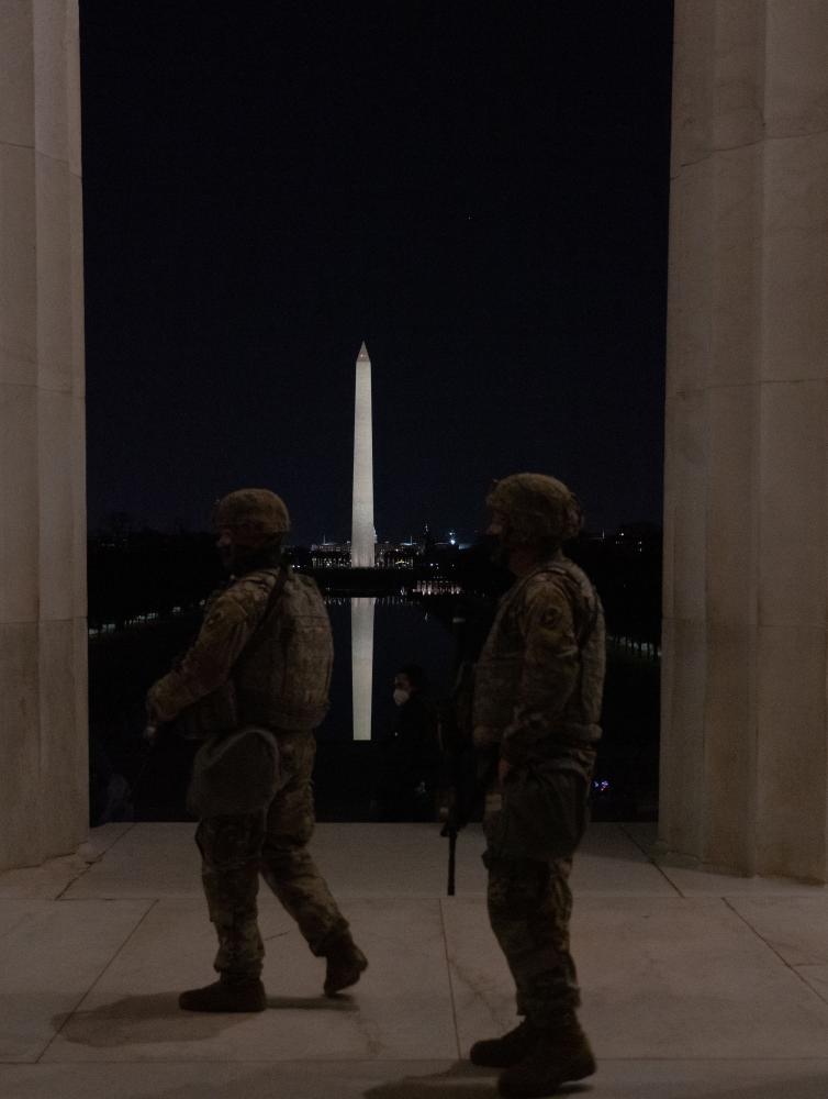 Two National Guardsmen patrol t...ederal buildings and monuments.