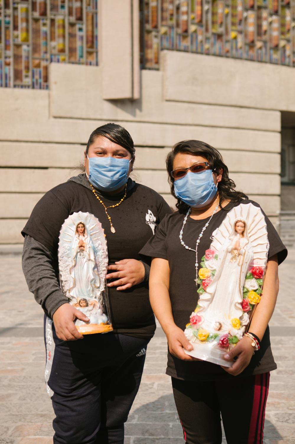 Dulce Vianney Raymundo Alvarado (left to right), 30, and Carmelita Mundia Molina, 37 rom Puebla, Mexico, pose for a portrait at the Basilica of Our Lady of Guadalupe in Mexico City, Mexico. &quot;Today I feel a little bad because we are not going to do the pilgrimage as it should be done but I thank God that he gave us the opportunity to come and at least, visit [the basilica.]&quot;, said Dulce Vianney Raymundo Alvarado. Dulce&#39;s phone number: 2 33 117 2233 Carmelita&#39;s: 2 33 103 44 60