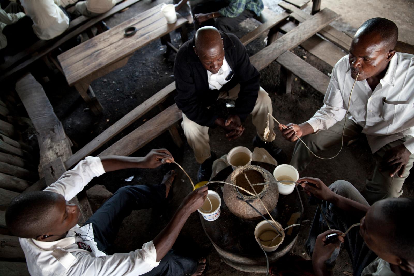 A group of Kenyans drink Busaa,... especially among young people.