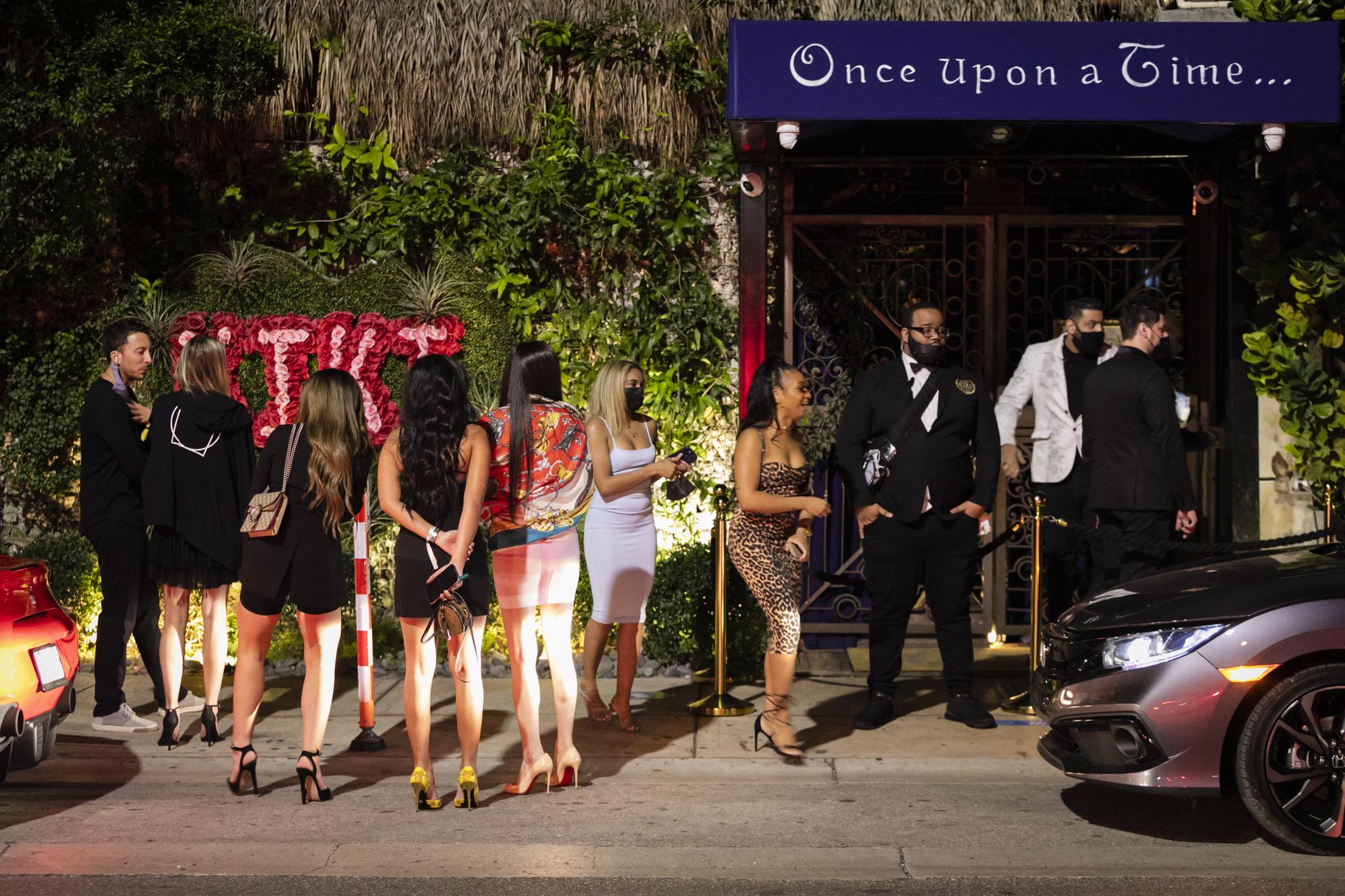 Miami with Covid-19 for ELLE Magazine - People gather outside a night club, in Miami, Florida on...