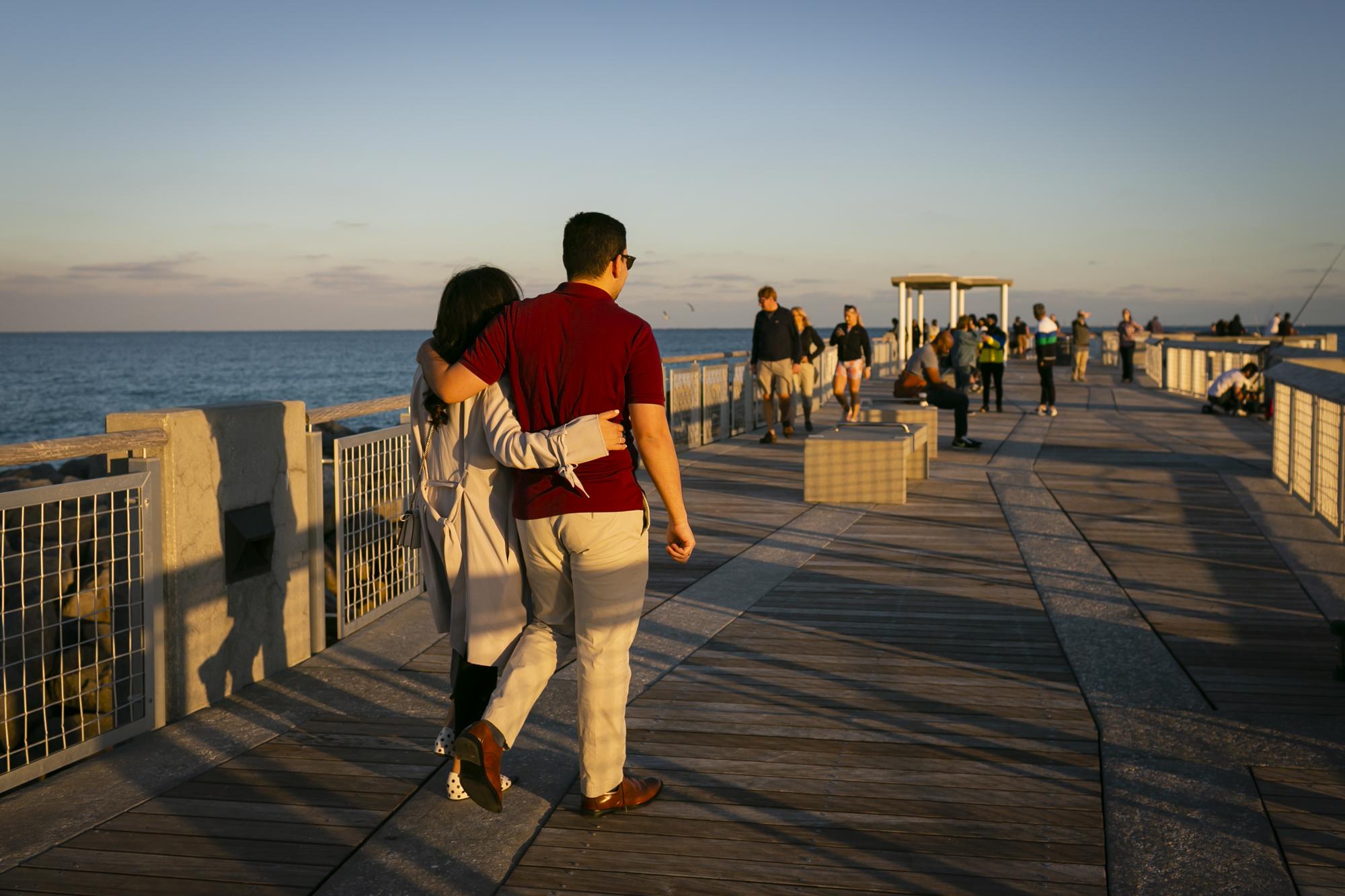 Miami with Covid-19 for ELLE Magazine - A couple walk at South Pointe Park Pier, in Miami Beach,...