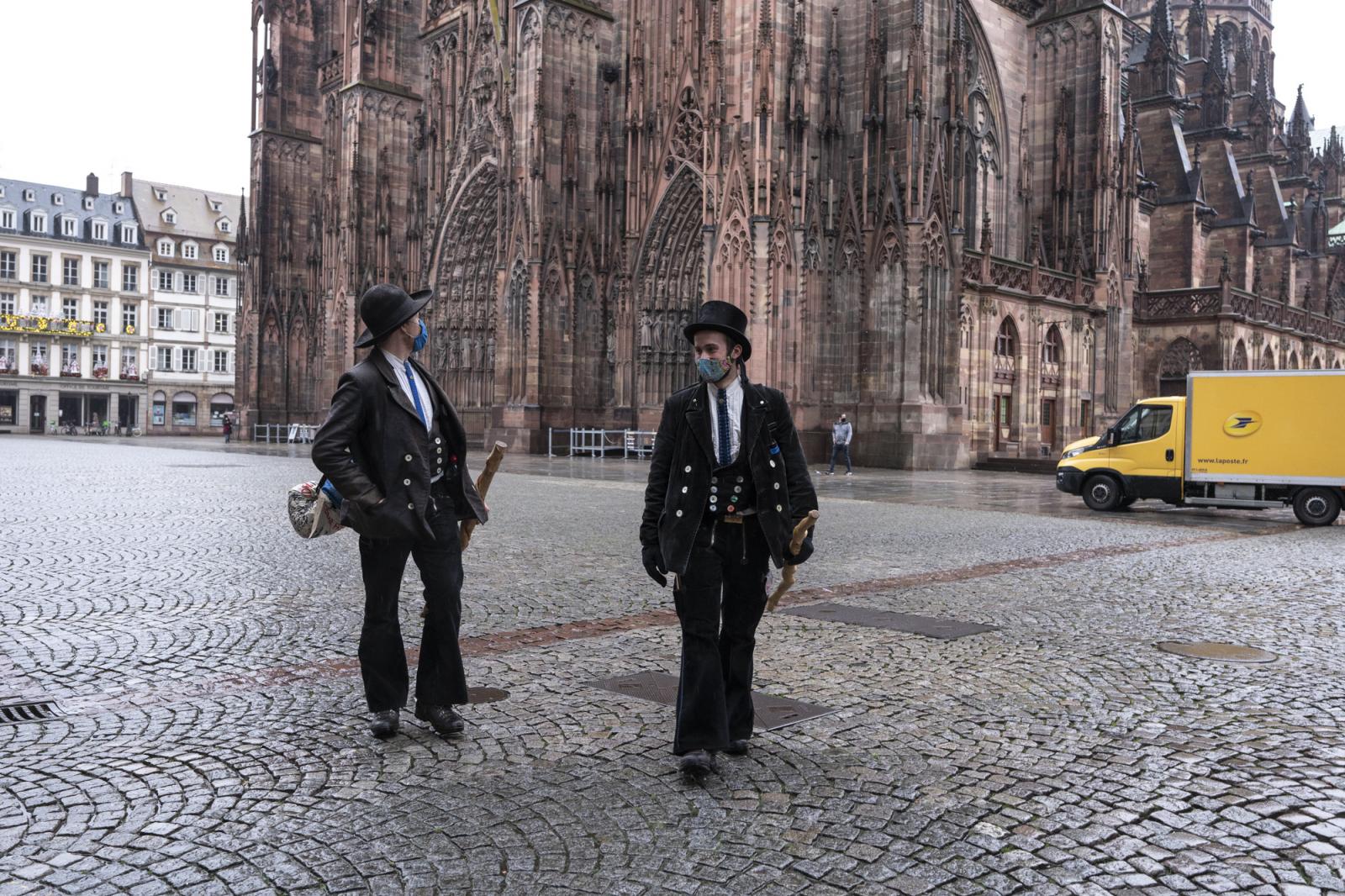   -  Ben (L) and Matthias walk away from the cathedral of Strasbourg, where they just met to start...
