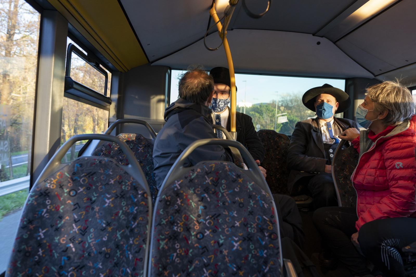  -  Matthias (C-L) and Ben (C-R) sit in the backseat of a bus during a trip from Irun to San...
