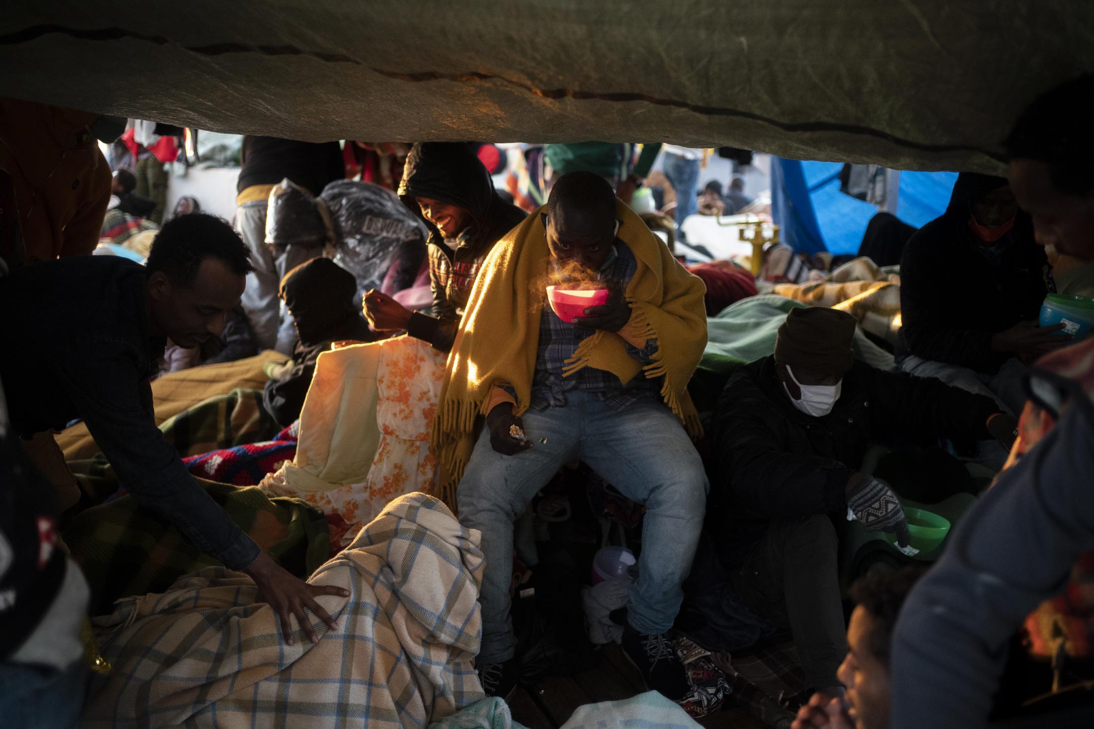 Open Arms #79 - A migrant from Sudan have breakfast on board the Spanish...