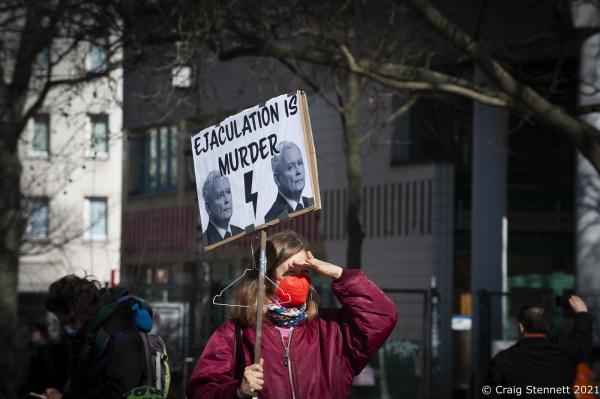 Image from Campaign Against Paragraph 218, Berlin, Germany - International Women‘s Day. A Woman holds a banner...