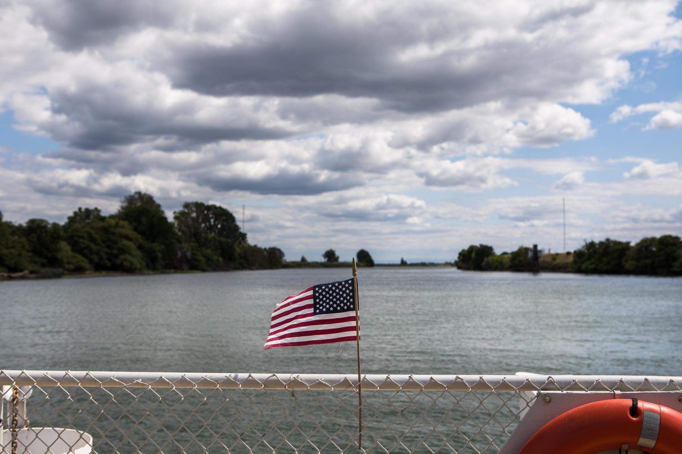  - The Delta  - The American flag blows in the wind on board the ferry....