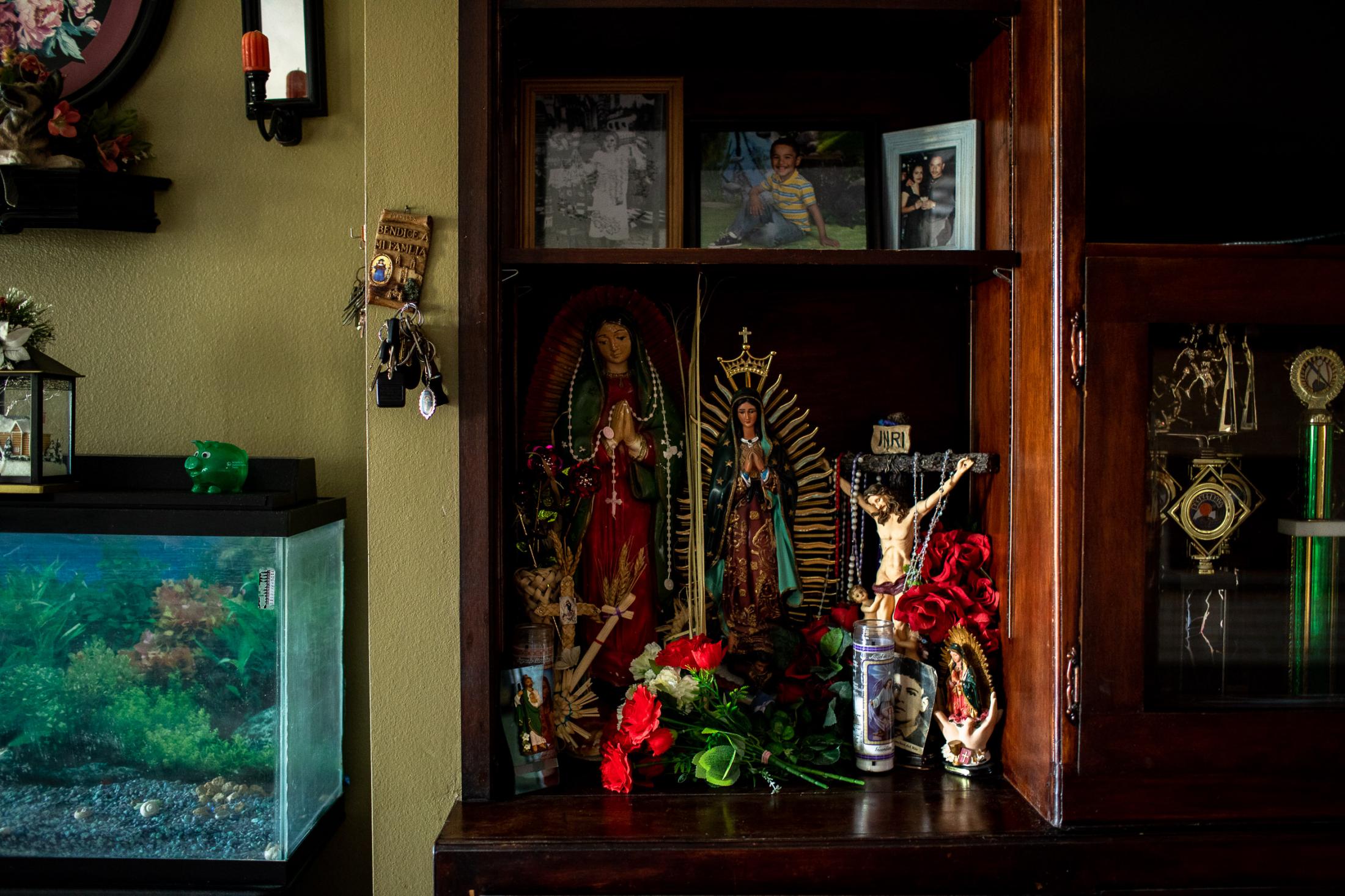  - Pesticides poisoning  -  The family alter, with family pictures and trophies. 