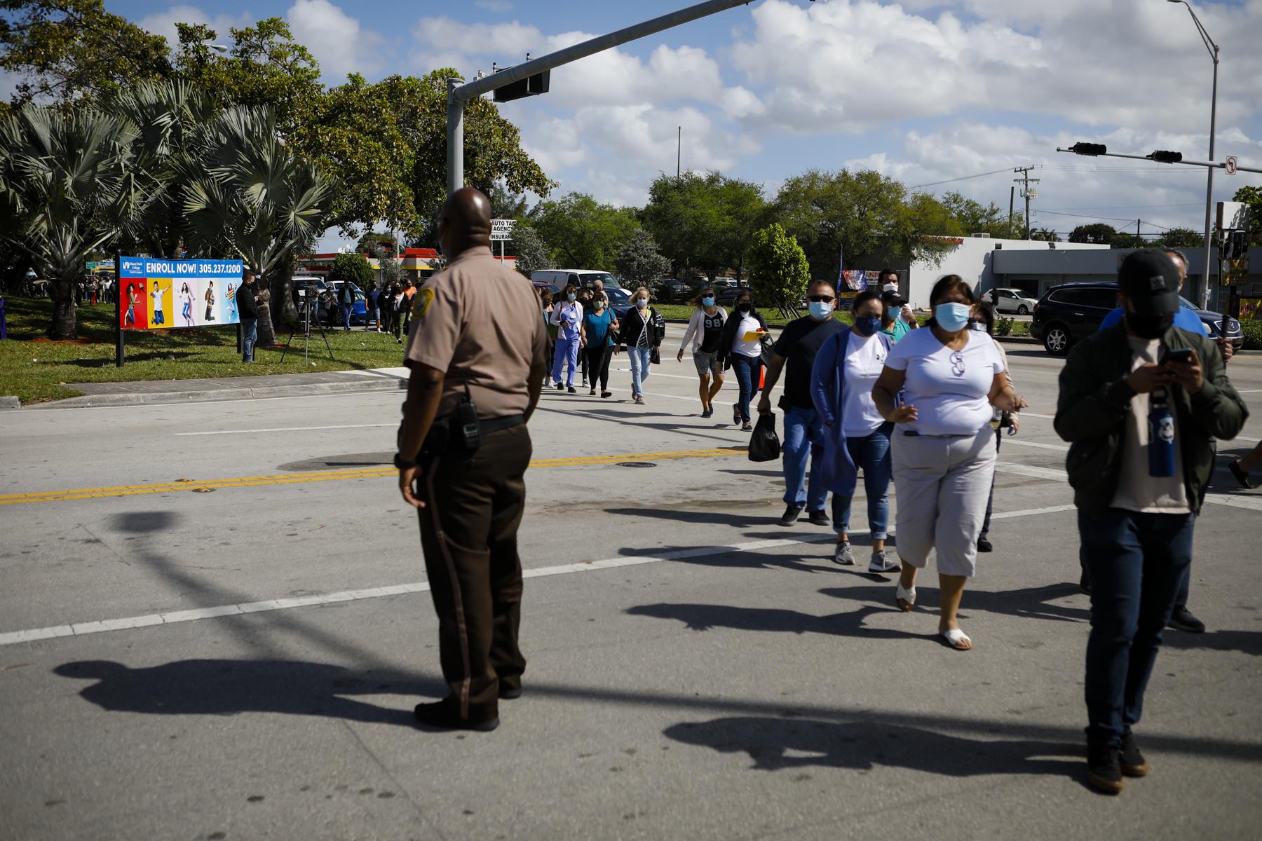 FEMA vaccination facility in North Miami - People wait in line to get the COVID-19 vaccine in a...