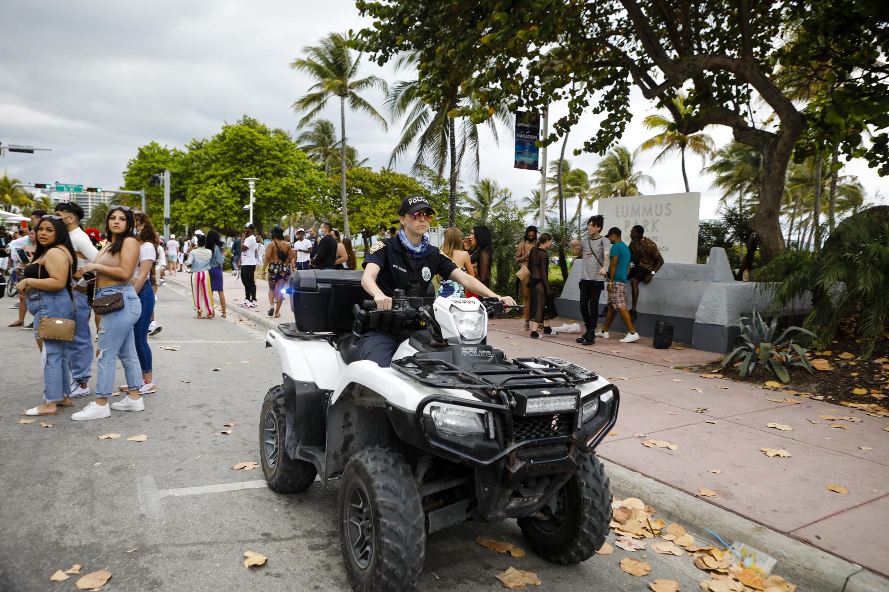 2021 Spring Break @ Miami Beach - A Miami Beach police officer patrols the street in Miami...
