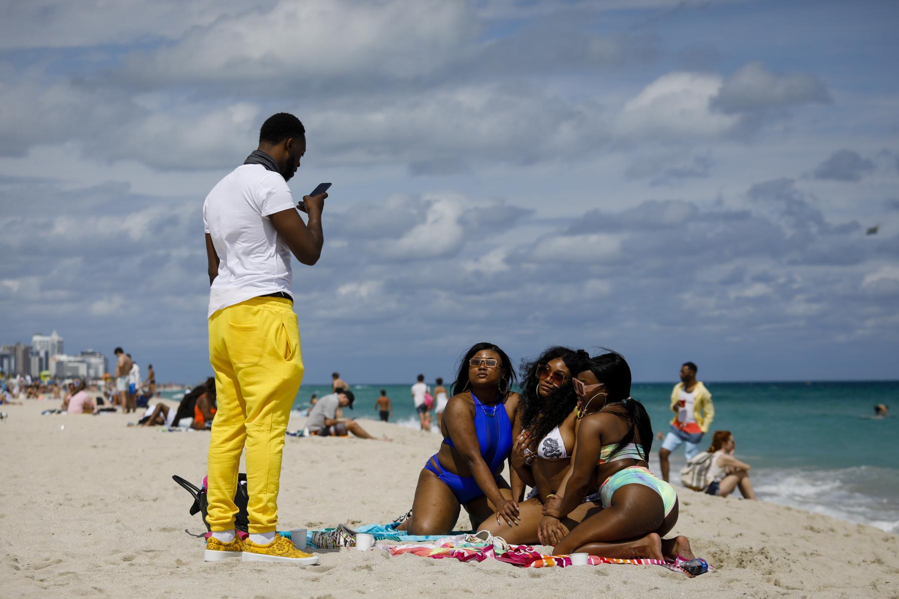 2021 - Spring Break @ Miami Beach - Tourists take photographs during Spring Break in Miami...
