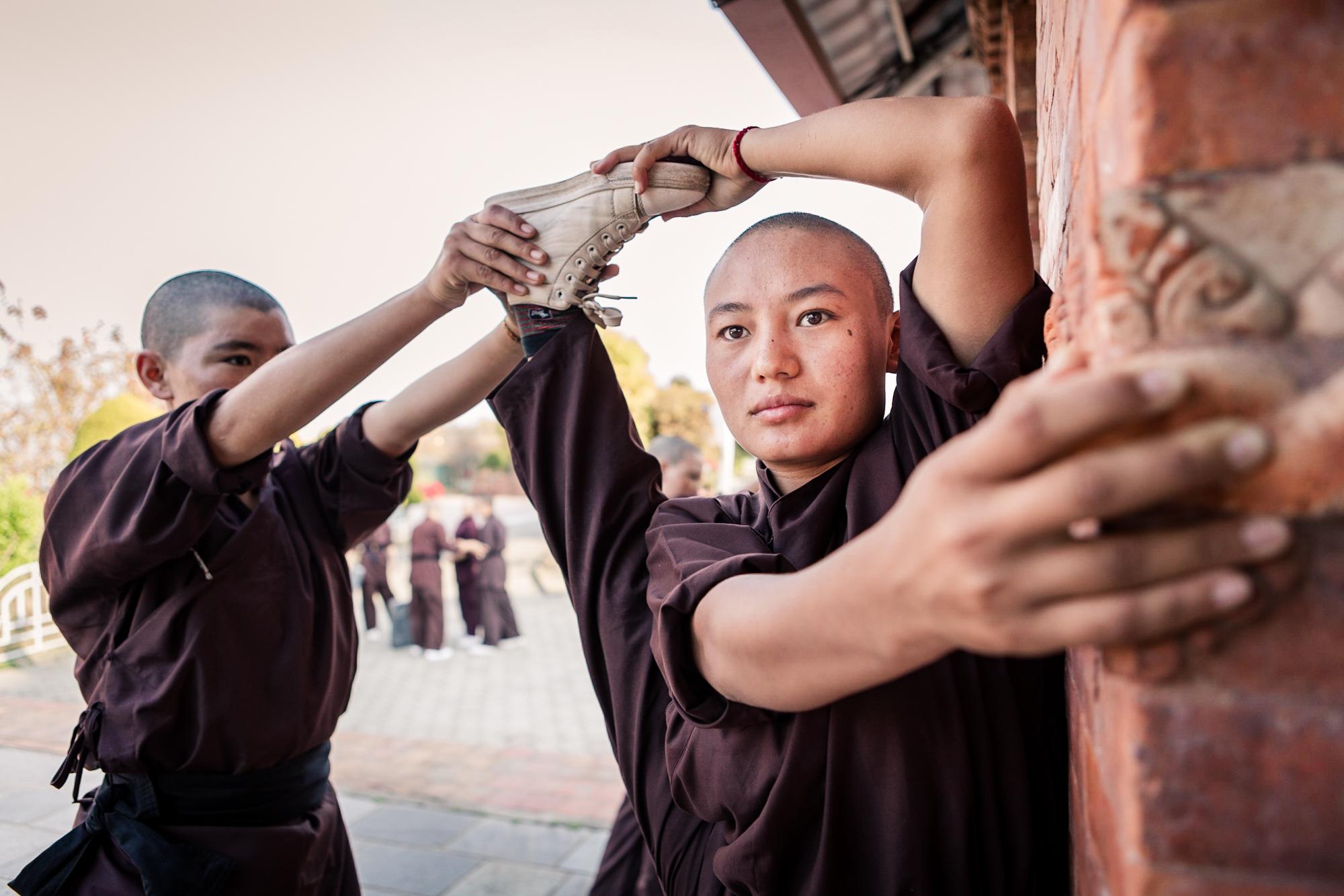 THE KUNG FU NUNS OF THE HIMALAYAS  - Jigme Jangchub Chosdon (right),18, pictured during Kung...