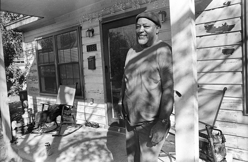 Big Mike, on his front porch on... Homewood Heights neighborhood.