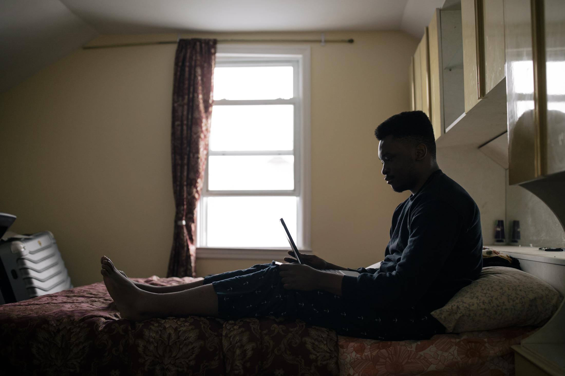 New York City, New York &mdash; February 11, 2021: Christian Nwenyi, 18, Senior at Stuyvesant High School and Director of Tutoring for EduCove, at his home during a virtual meeting with Co-Founder of the free tutoring service, Ian Lau, and EduCove team members Joyce Lin and Subyeta Chowdhury, in early February where the group explored ways to pass down the service to underclassmen. As the pandemic continues to impact the lives of students reliant on the city&rsquo;s public schools for education, a group of Stuyvesant High School students launched EduCove, a free tutoring service connecting teens from the city high schools with students in kindergarten through eighth grade, to help aid New York City&rsquo;s most vulnerable students struggling in their studies. CREDIT: Jos&eacute; A. Alvarado Jr. for The Wall Street Journal