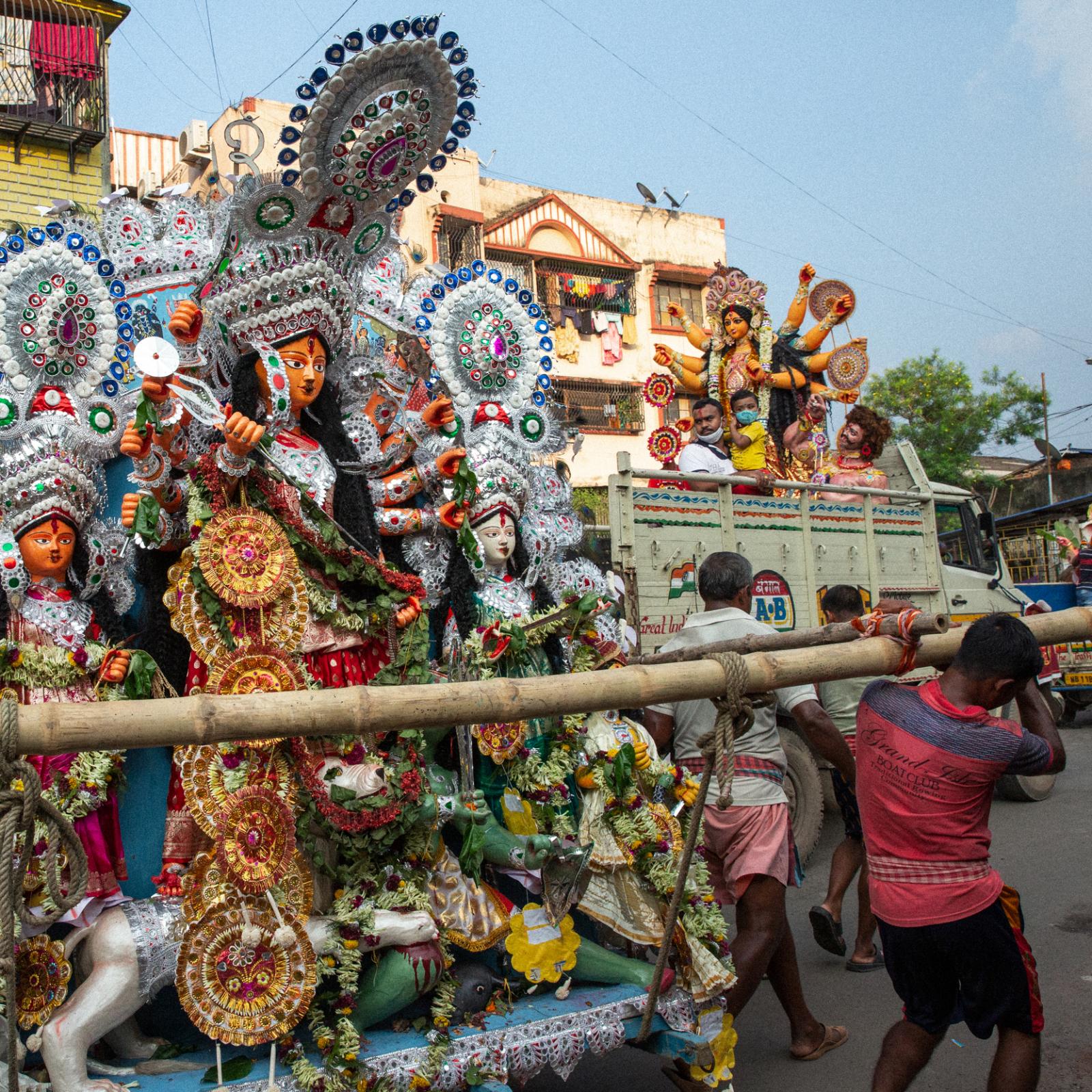 Plastic's Threat to Life Along the Ganges River - Celebrants transport a likeness of the goddess Durga...
