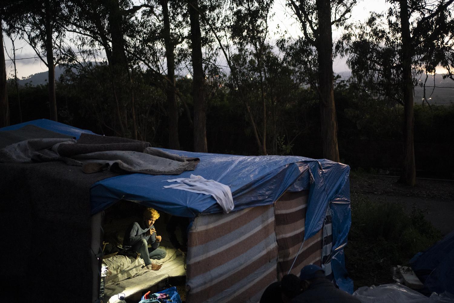 Ayoub, 22, from Morocco, rests ... instead. (AP Photo/Joan Mateu)