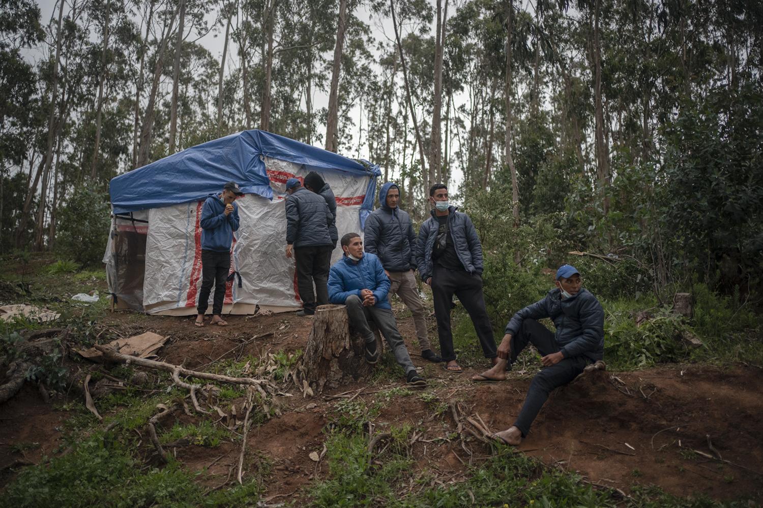 Las Raí­ces Camp - Migrants rest in Las Raices camp in San Cristobal de la...